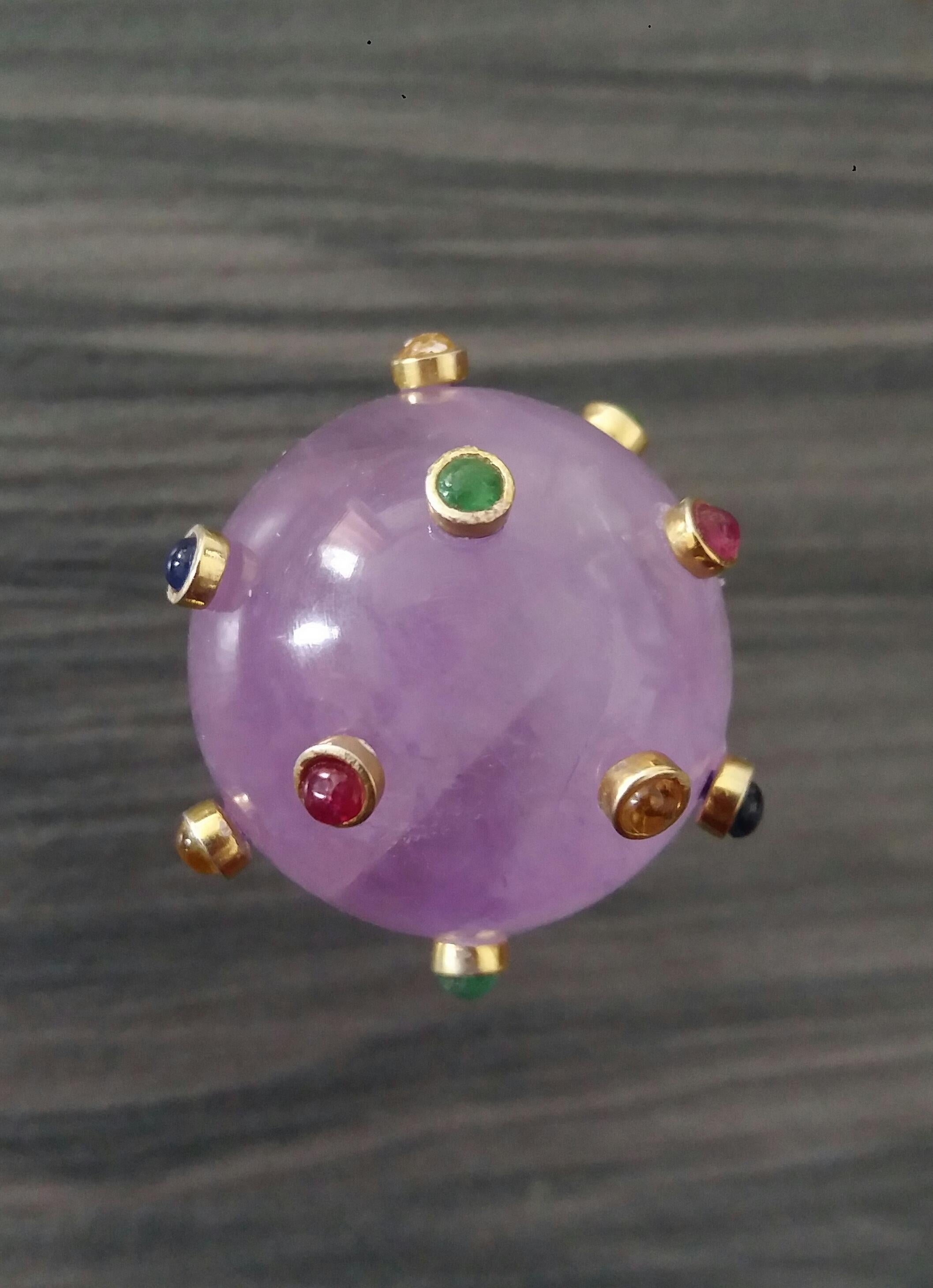 Extremely Stylish and Unique Ring composed by a Natural Amethyst  Sphere measuring 25 mm in diameter and weighing 115 Carats ,decorated with 15 small round Rubies,Emeralds,Blue and Yellow Sapphires set in 14K yellow gold bezels.

In 1978 our