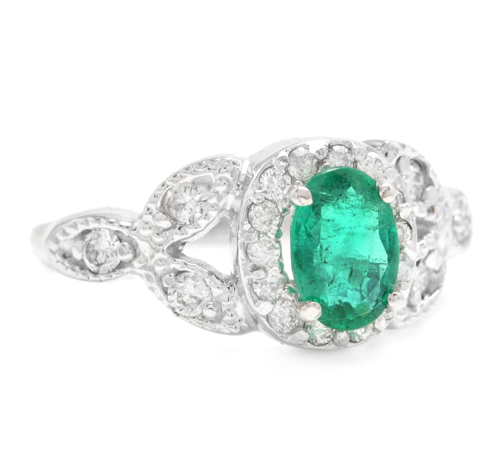 1.15 Carats Natural Emerald and Diamond 14K Solid White Gold Ring

Total Natural Green Emerald Weight is: Approx. 0.80 Carats (transparent)

Emerald Measures: Approx. 6.80 x 4.80mm

Natural Round Diamonds Weight: Approx. 0.35 Carats (color G-H /
