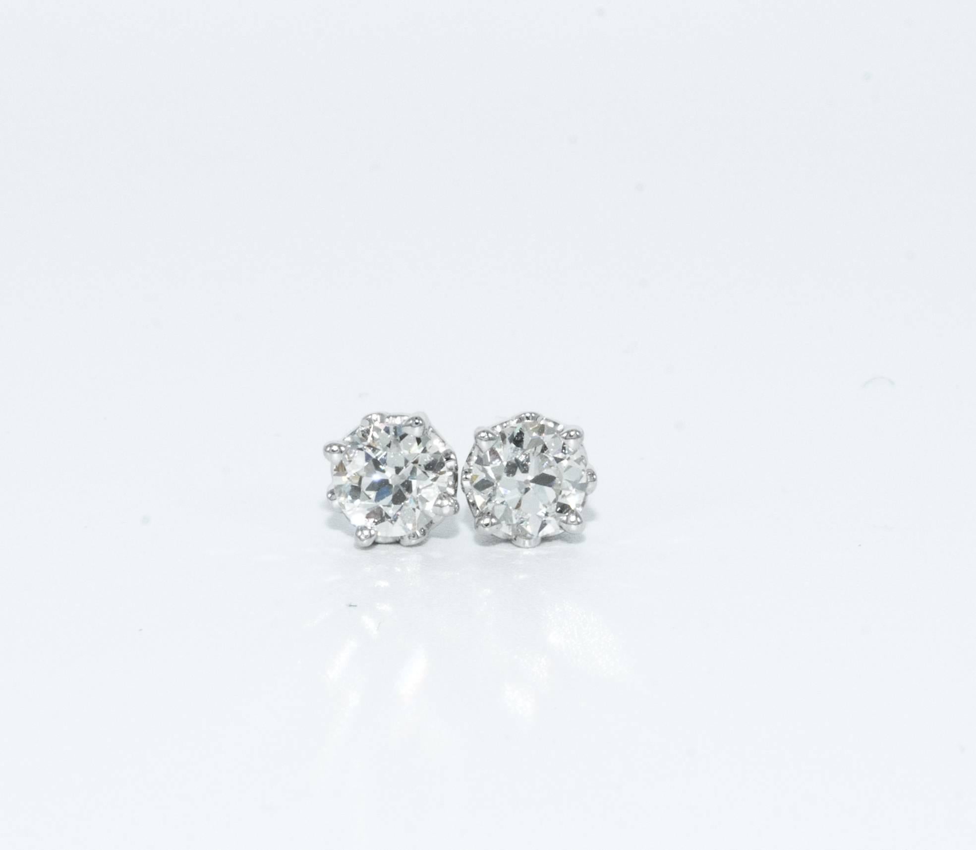 1.15 Carats Old European cut Diamond stud earrings
Color is J-K , Clarity is SI1
Both Diamonds are certified by American Gem Society Laboratory ( AGS #104079007009, & 104079007010)
5.3 MM Diameter, beautifully cut and perfectly matched pair 
Set in