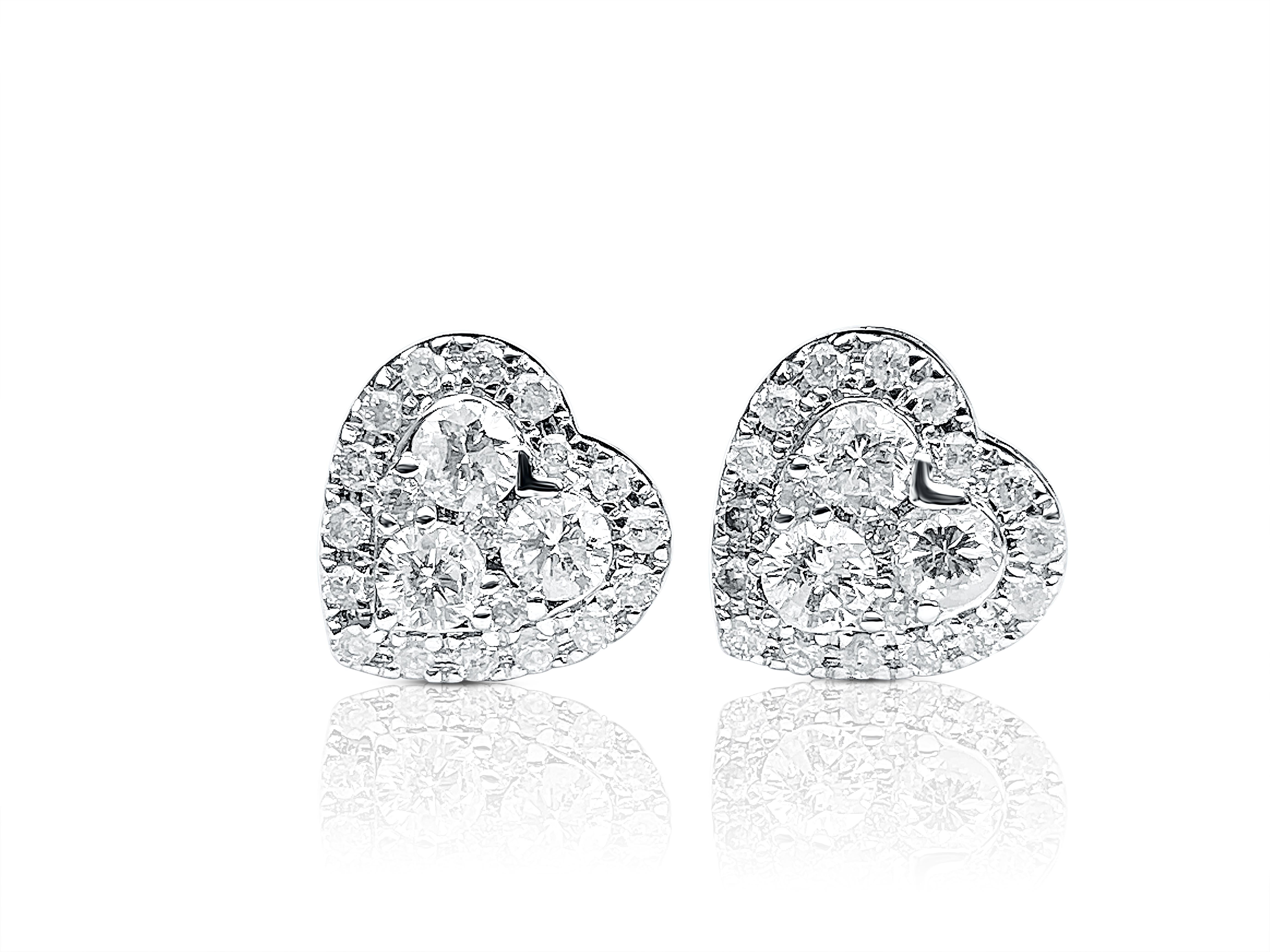 Set in 18K White Gold and adorned by a whopping 44 Round-Brilliant Cut White Diamonds, these lovely earrings are designed in a heart motif and are set with the symbol of eternal love– white diamonds.

Details:
✔ Stone: Diamond
✔ Diamond Weight: 1.15