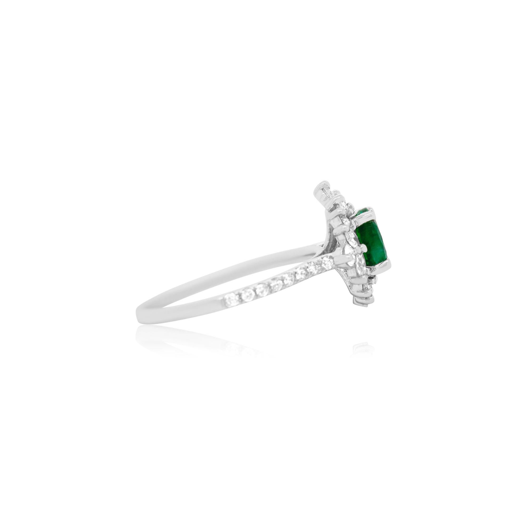 Material: 14K White Gold
Center Stone Details: 1 Round Emerald at 1.15 Carats at 7mm Size 
Side Stone Details: 8 Marquise White Diamonds at 0.26 Carats Total Weight 
24 Round Brilliant White Diamonds at 0.43 Carats Total Weight

Fine one-of-a-kind