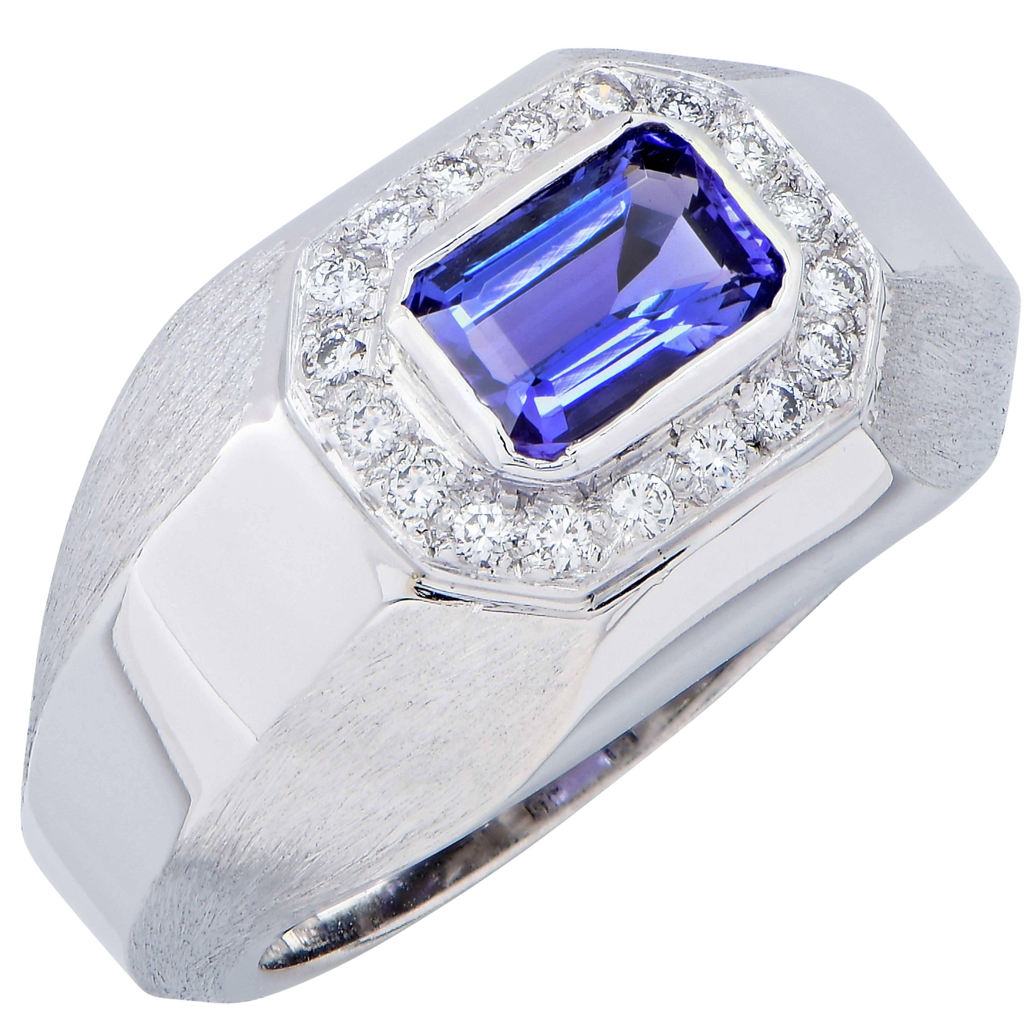 This elegant Tanzanite and diamond ring features an emerald cut Tanzanite weighing 1.15 carats and 18 round brilliant cut diamonds with a total weight of .20 carats.
Ring Size: 6 3/4 (can be sized)
Metal Type: 18 Karat White Gold
Metal Weight: 13