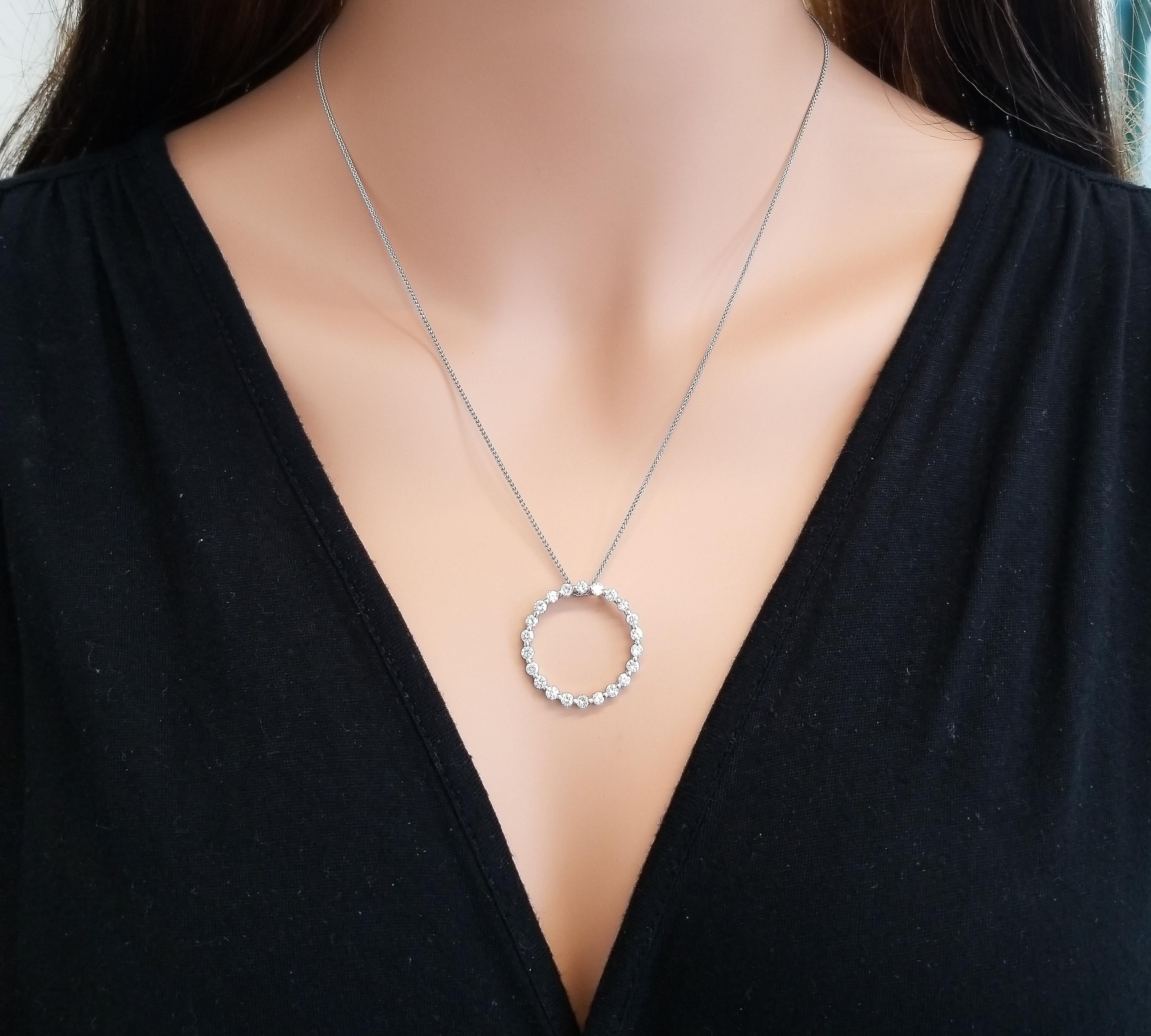This circle pendant is set ablaze with fiery round brilliant diamonds. This diamond classic is subtle yet sophisticated at the same time. Wear it with your favorite casual attire, or your dressiest dress. The pendant features 1.15 carat illuminating