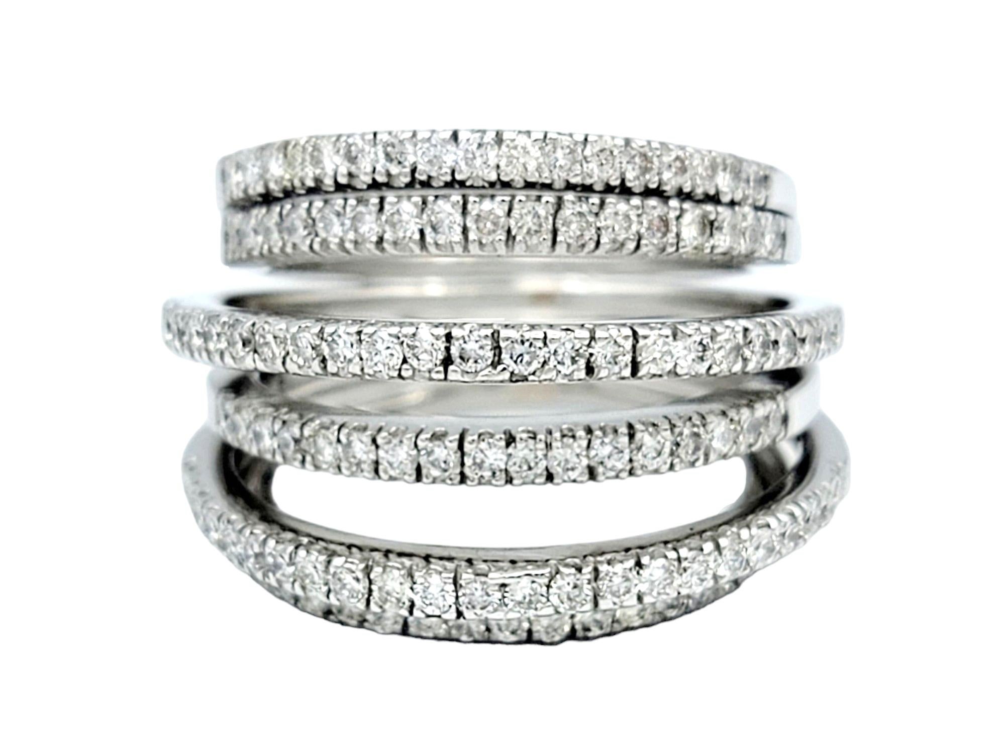 Ring Size: 6

This timeless diamond band ring set in luxurious 18-karat white gold artfully creates the illusion of seven individual diamond bands beautifully fused together. Set in varying heights, the layered look of the bands adds depth and