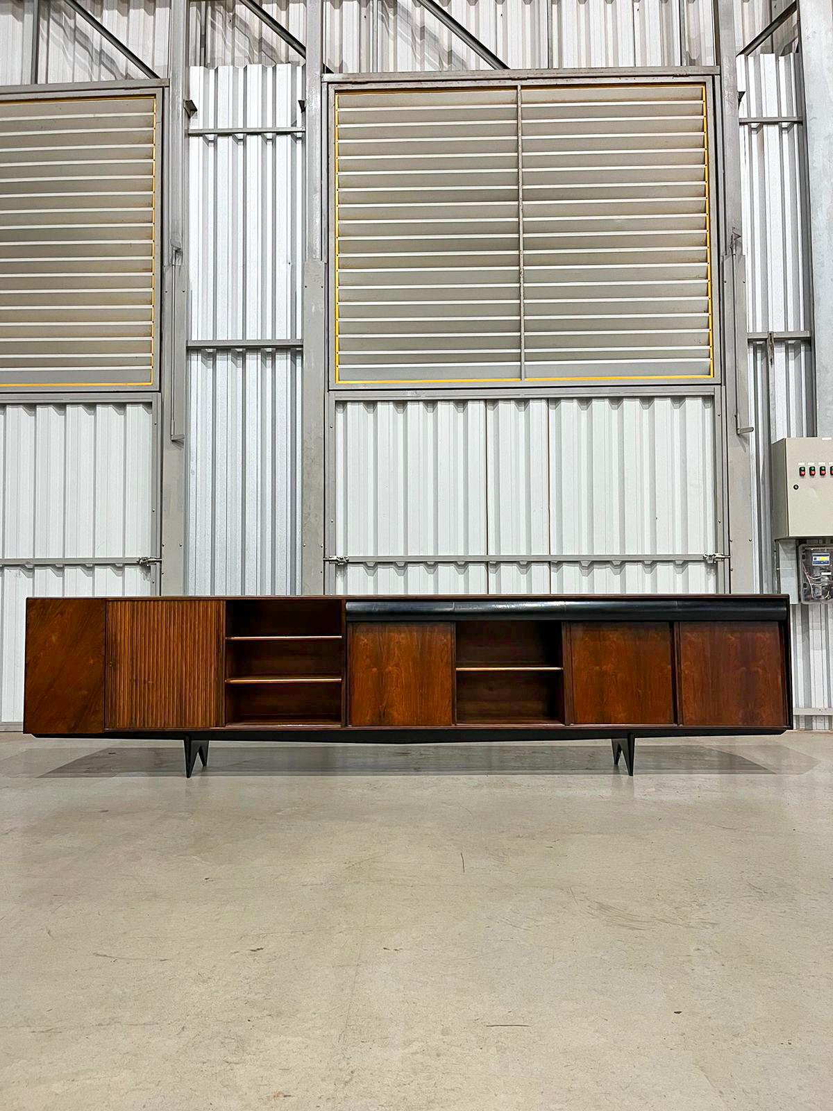 Available today in NYC, this 11.5” Credenza in Hardwood by Carlo Hauner & Martin Eisler, Brazil, c. 1950 is nothing less than magnificent!

This credenza is made with the finest Brazilian rosewood, also known as jacaranda, and has four drawers, four