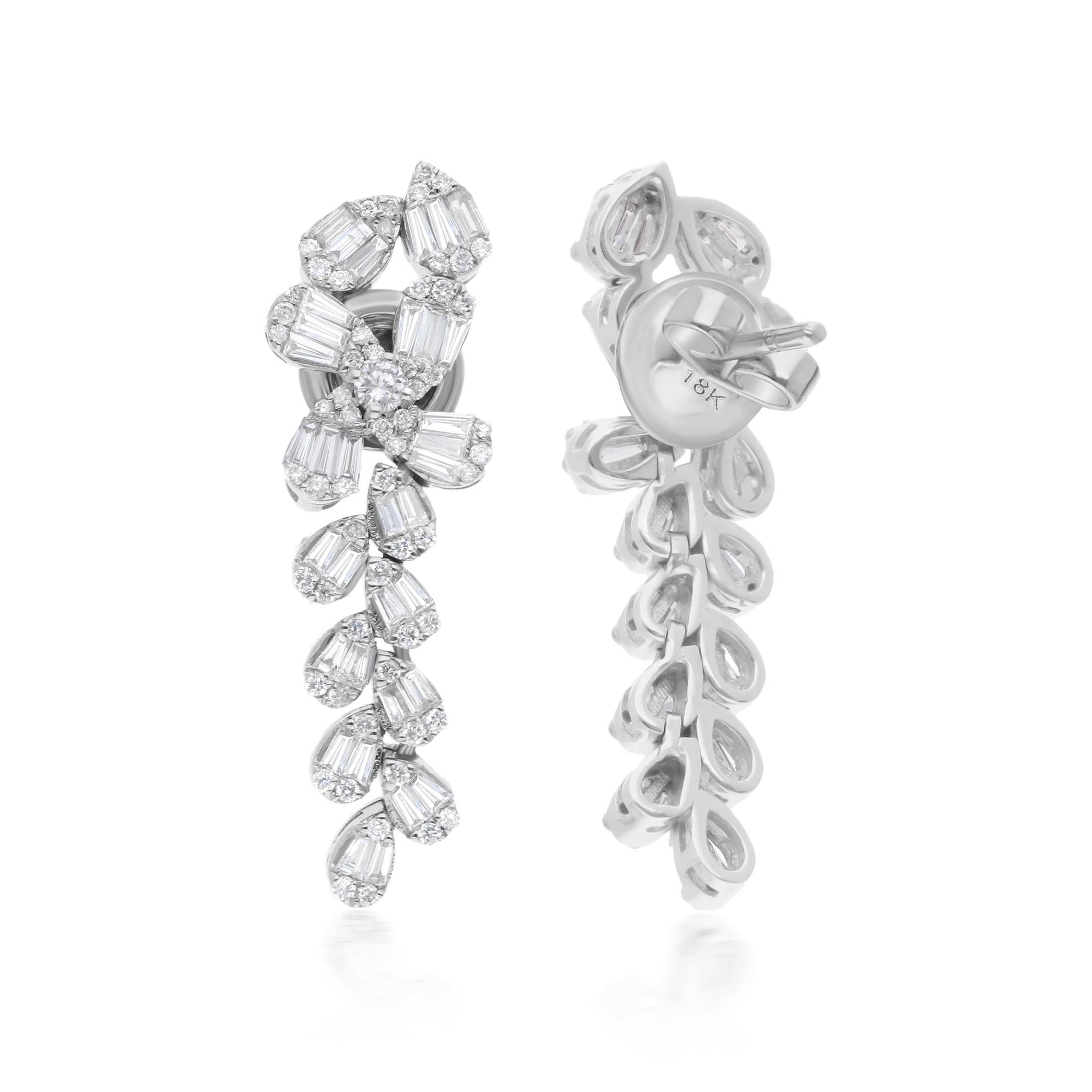 At the center of each earring, a radiant array of baguette and round diamonds takes center stage, meticulously arranged to create a captivating dangle design. The sleek elegance of the baguette diamonds is complemented by the timeless brilliance of