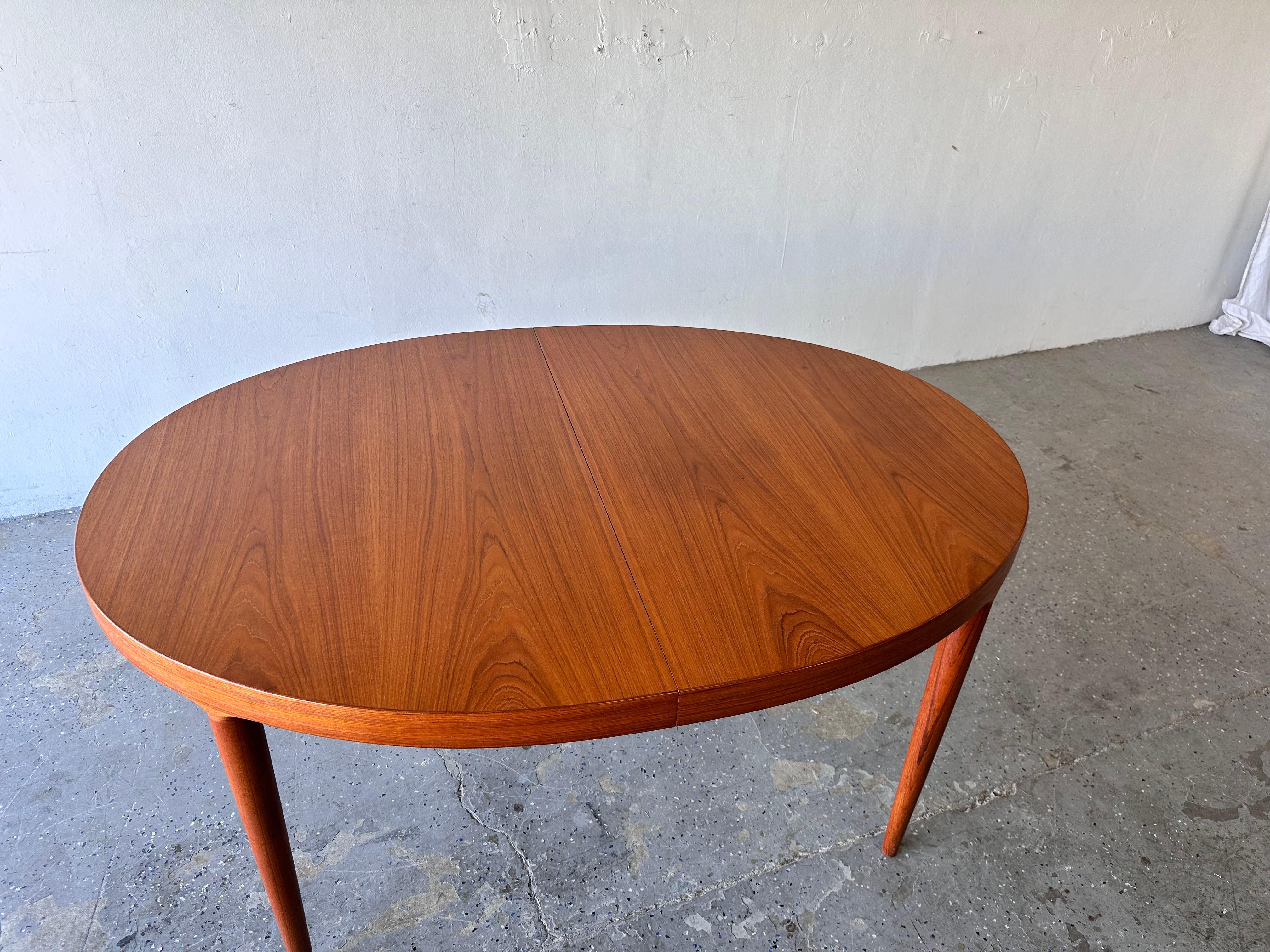 
Beautiful Teak dining table by Moreddi of denmark Designed by Harry Ostergaard. The teak grain is just stunning. Seats 4 up to 12. Has a extra leg that pulls out to support trable when fully extended.
   It is almost inImpossible to find a 12 seat