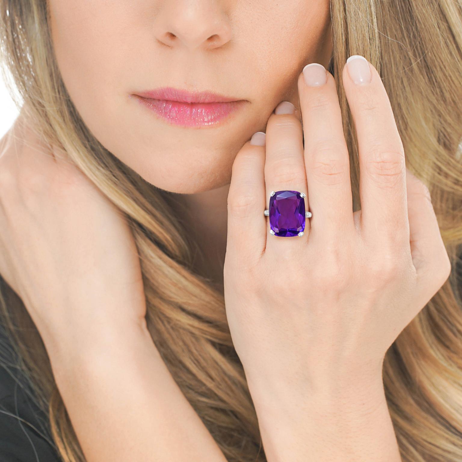 Circa 1950s, 14k, American. This gorgeous fifties ring is set with a lush 11.50 carat amethyst, accented by .15 carats of brilliant diamonds. Meticulously fabricated in fourteen karat white gold, it is in excellent condition. 

Remark: 