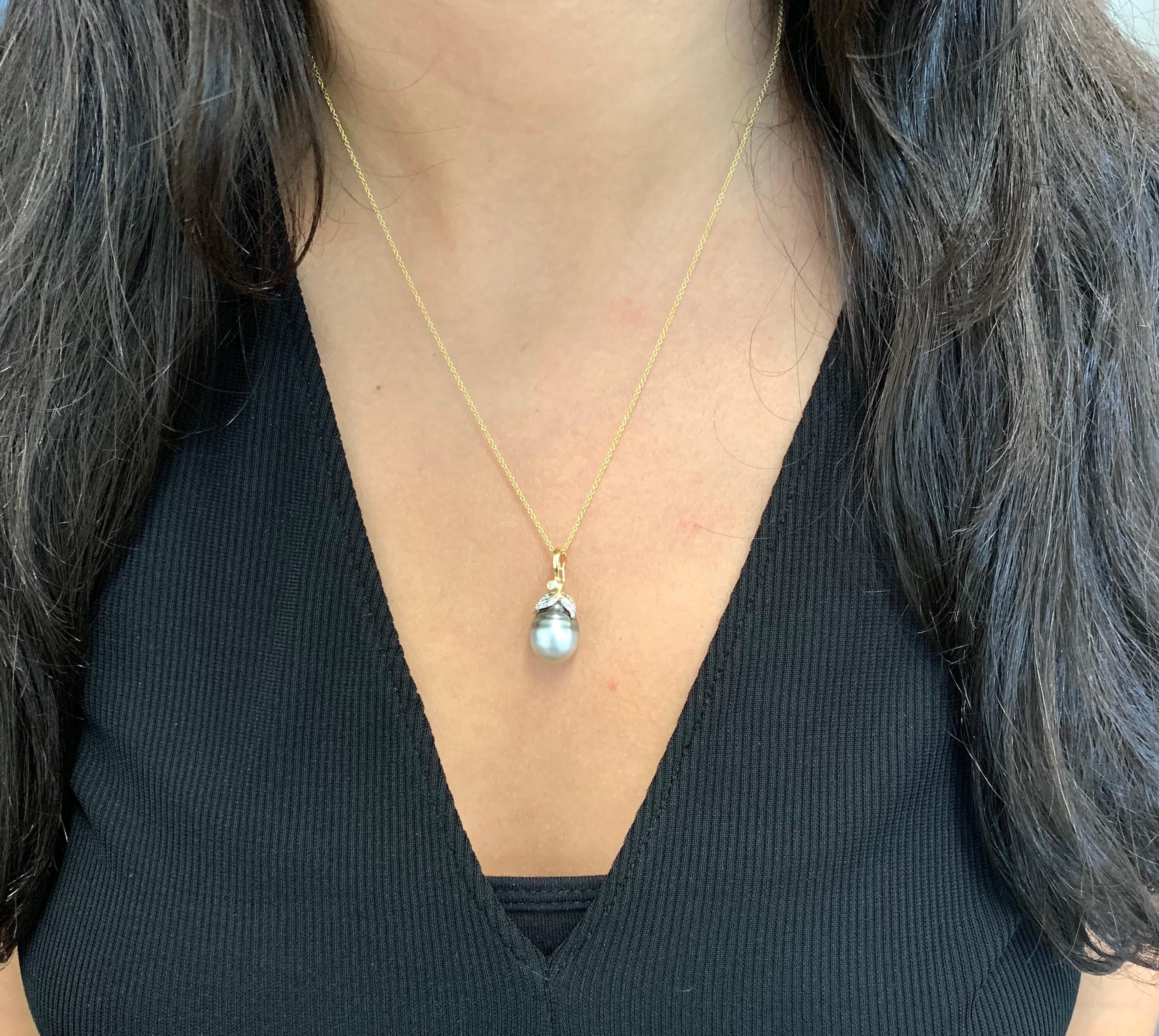 Material: 14K White Gold
Center Stone Details: 1 Pearl at 11.50 Carats Total
Diamonds: Round Brilliant Diamonds at 0.03 Carats. SI Clarity/ H-I Color

Fine one-of-a-kind craftsmanship meets incredible quality in this breathtaking piece of