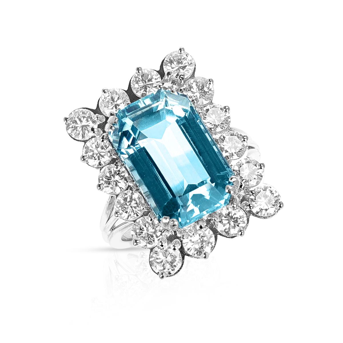 An Emerald-Cut Aquamarine and Diamond Cocktail Ring made in 18 Karat Yellow Gold. The aquamarine weighs appx 11.50 carats. The ring size is US.
