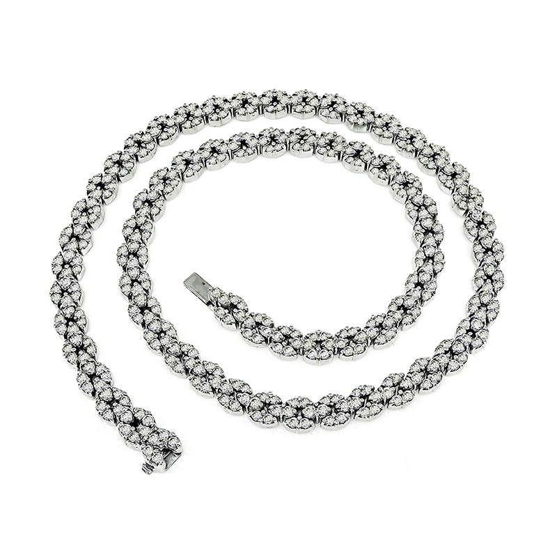 This is a magnificent 18k white gold necklace. The necklace is set with sparkling round cut diamonds that weigh approximately 11.50ct. The color of these diamonds is H with VS clarity. The necklace measures 16 inches in length and 6mm in width. The