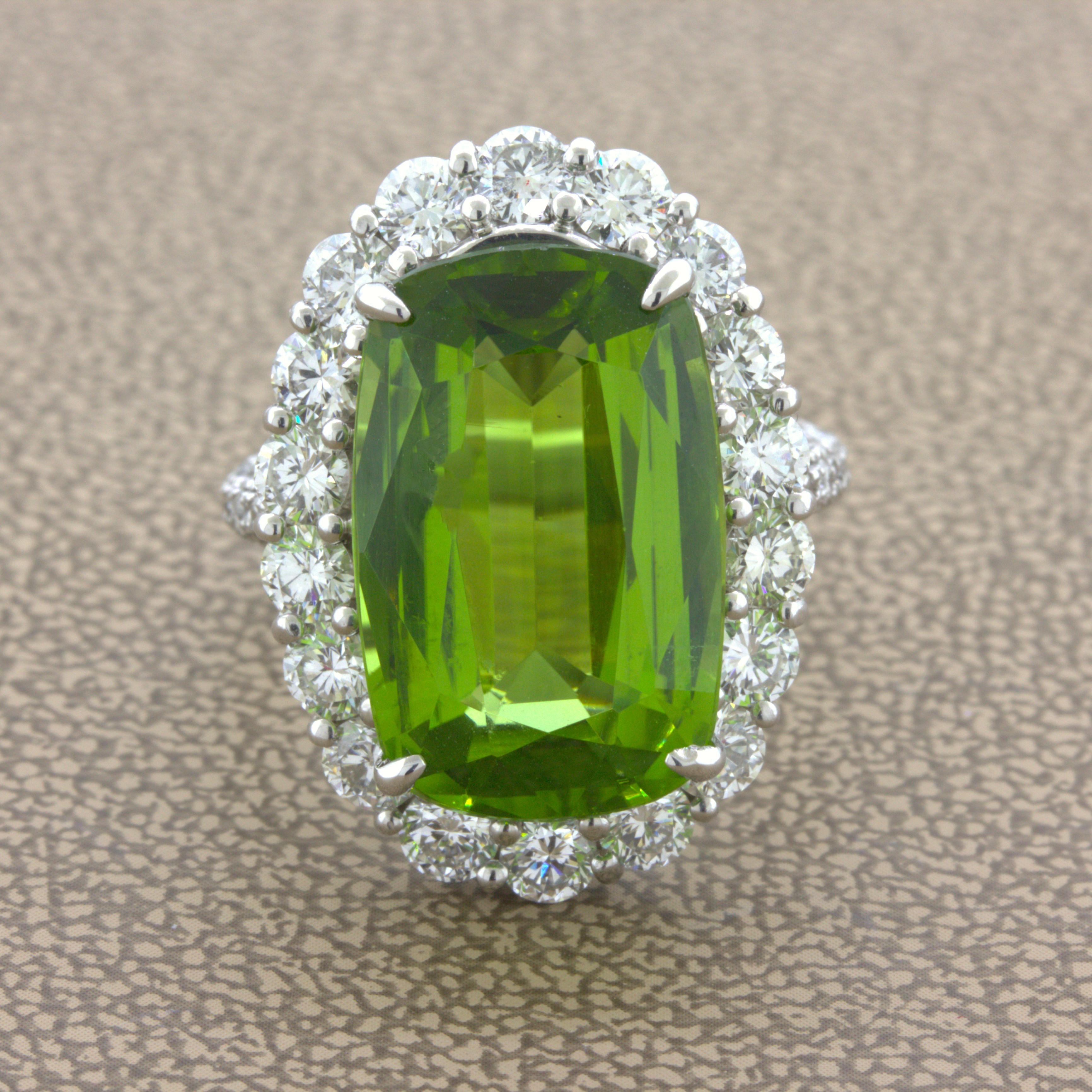 A classic diamond halo ring with a very fine gem peridot in its center. It weighs an impressive 11.52 carats and has a rich and lively green color with a touch of yellow which peridot is known for. Adding to that, it has a lovely, elongated