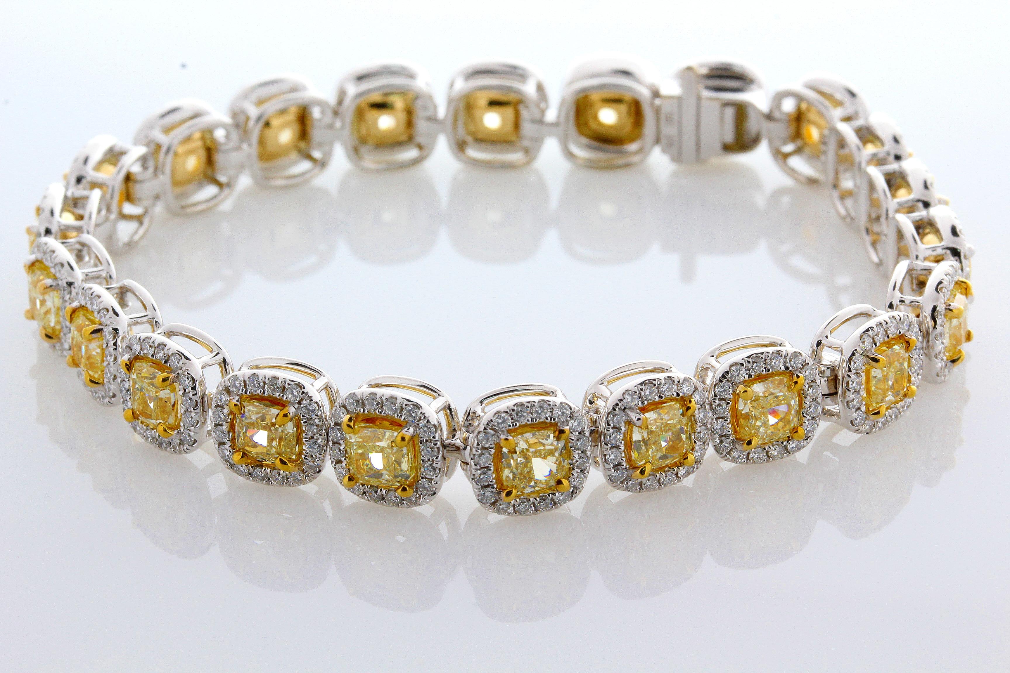 Incredible Deal on 11.53 Carat Cushion Cut, perfectly matched Natural Fancy Yellow, VS2 Clarity Diamond Tennis Bracelet. Total Carat Weight on the Bracelet is 14.23.
This contemporary mounting is formed from 18 Karat White and Yellow Gold, 34.60