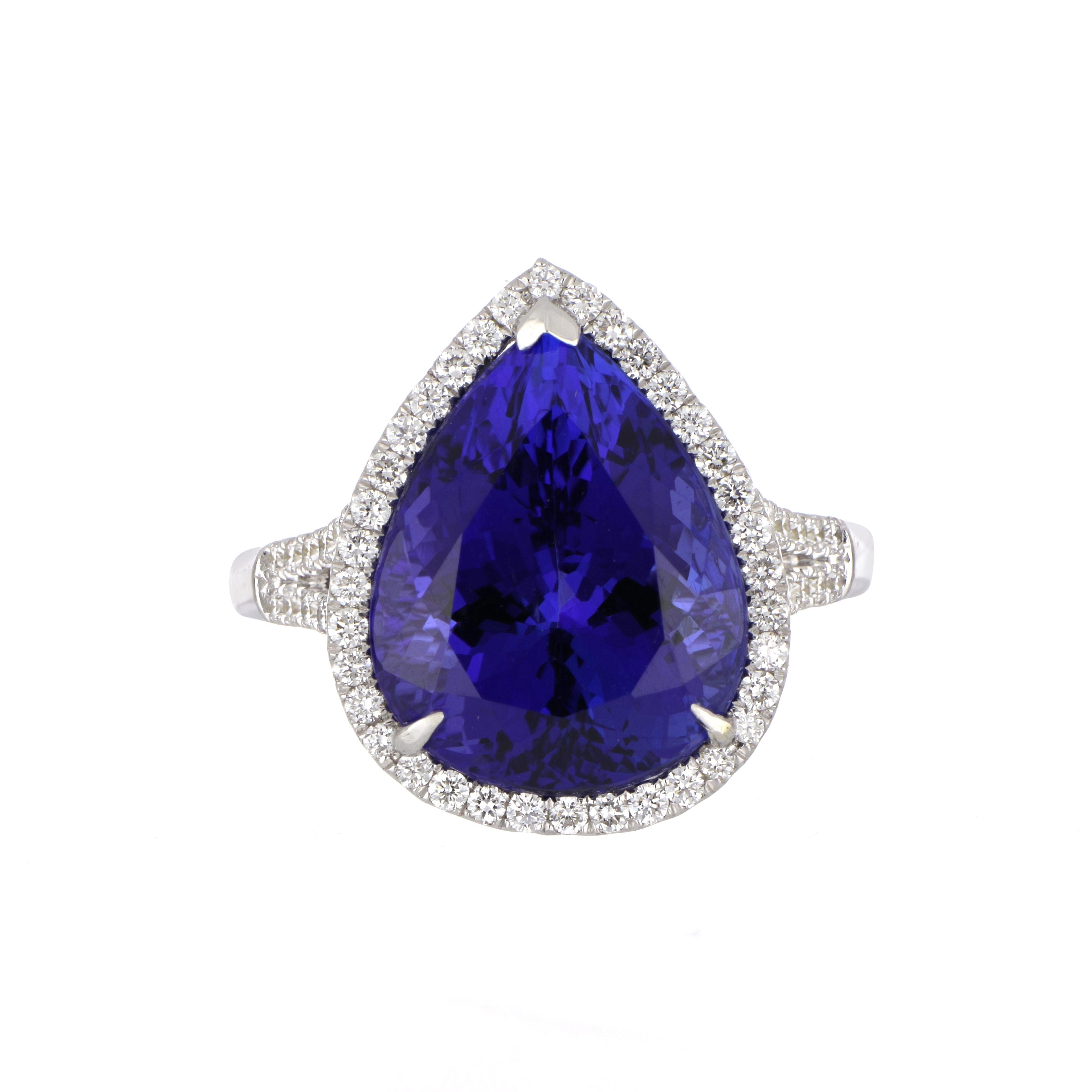 Elegant and exquisitely detailed Gold Ring, centre set with 11.53 Ct Tanzanite, surrounded by and enhanced on shank with micro pave Diamonds, weighing approx. 0.54 total carat weight. Beautifully Hand crafted in 18 Karat white Gold.

Stone Size: