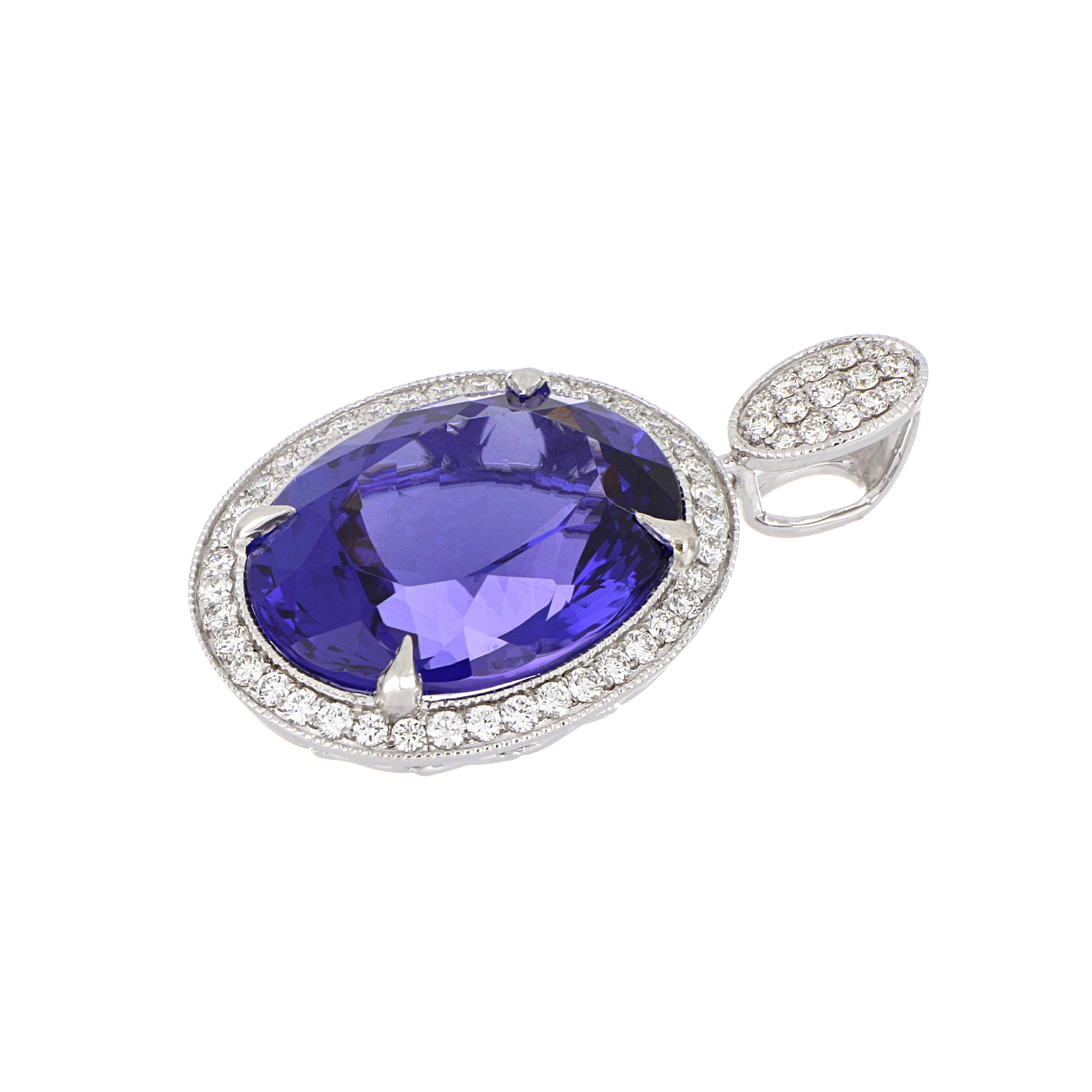 Elegant and exquisitely detailed Gold Pendant, centre set with 11.54 Ct Tanzanite, surrounded by micro pave Diamonds in Halo, weighing approx. 0.44 total carat weight. Beautifully Hand crafted in 18 Karat white Gold.

Stone Size: 16 x 12.7