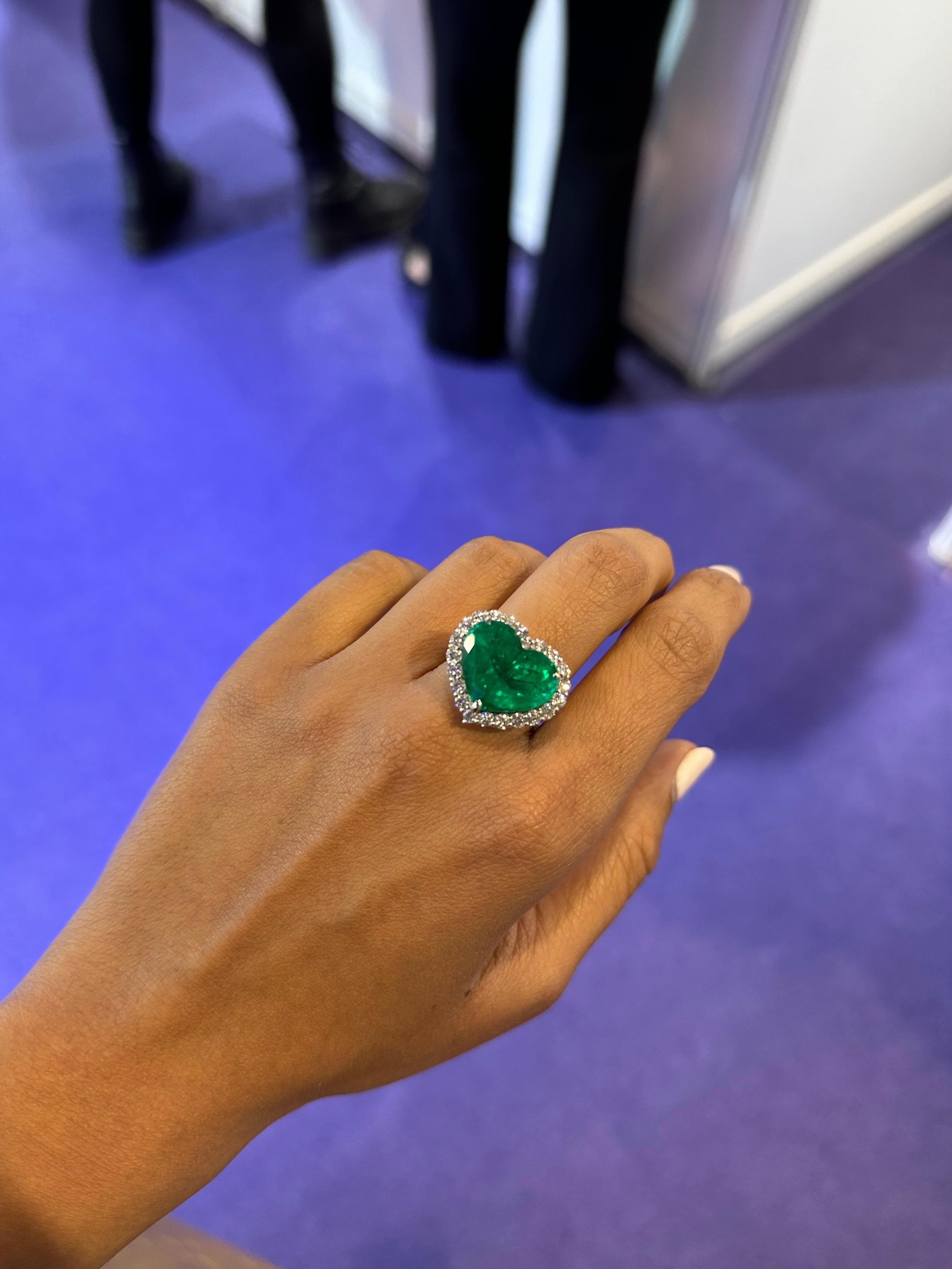 A beautiful 11.56 carat Colombian Emerald, set in Platinum with 1.56 carat brilliant cut diamonds. Currently sized at US7, can be resized.