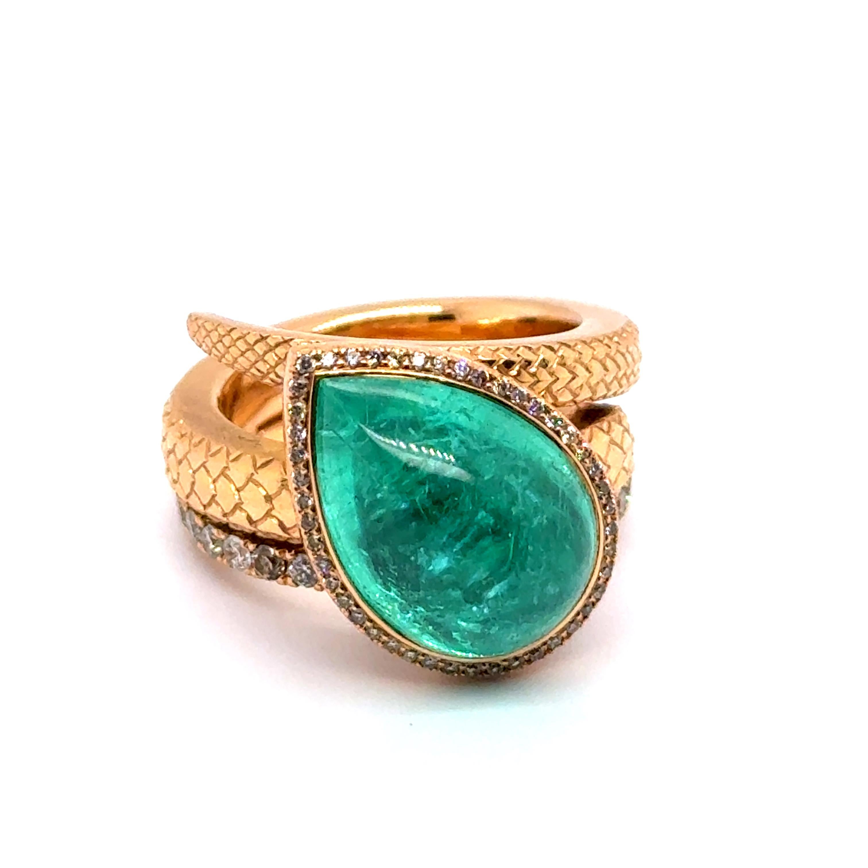 This exquisite ring showcases a mesmerizing 11.57-carat pear-cut Paraiba tourmaline in a striking bluish-green hue, sourced from Mozambique. 

The vibrant gemstone is elegantly framed by a halo of 32 brilliant-cut diamonds, enhancing its radiant