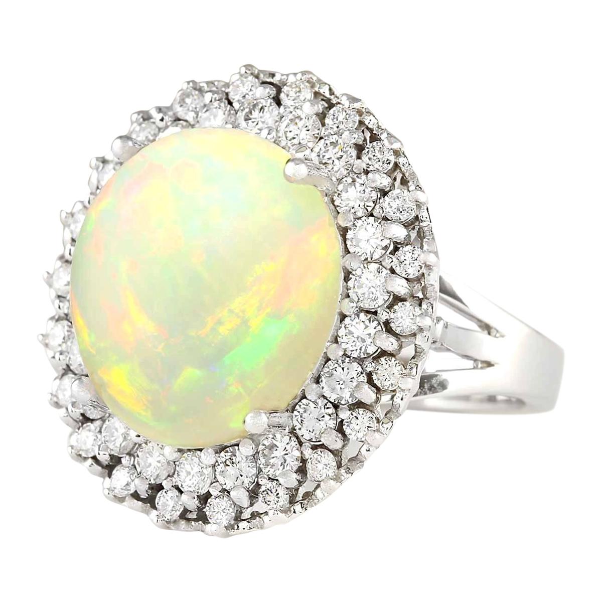 11.59 Carat Opal 14 Karat White Gold Diamond Ring
Stamped: 14K White Gold
Total Ring Weight: 12.1 Grams
Total  Opal Weight is 10.14 Carat (Measures: 16.00x14.00 mm)
Color: Multicolor
Total  Diamond Weight is 1.45 Carat
Color: F-G, Clarity: