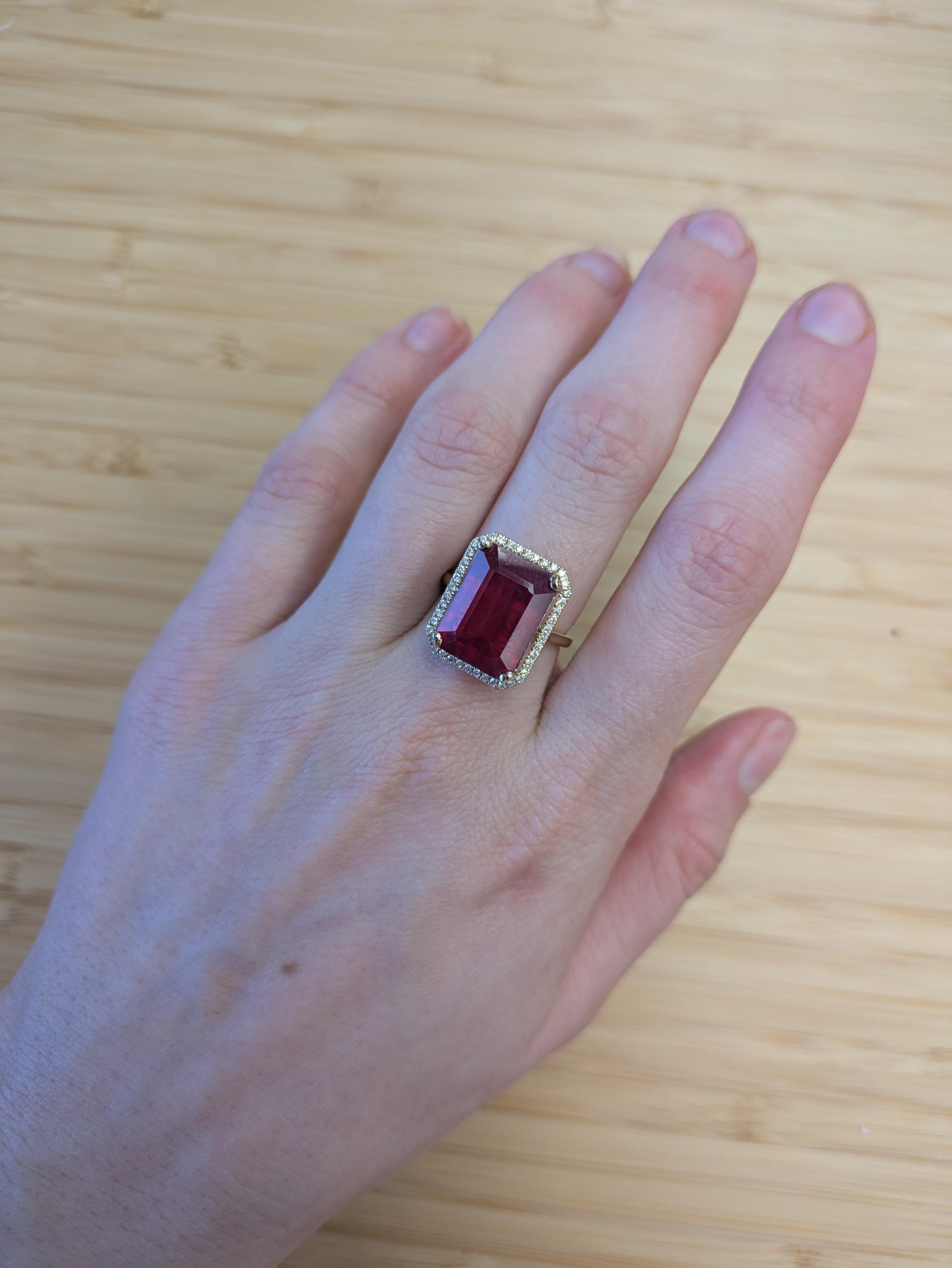 Make a bold statement with this captivating Madagascar Ruby ring. The vivid red center stone is framed by a halo of sparkling earth-mined diamonds, all set in luxurious 14k solid gold. This ring can be a lovely July birthstone gift for your loved