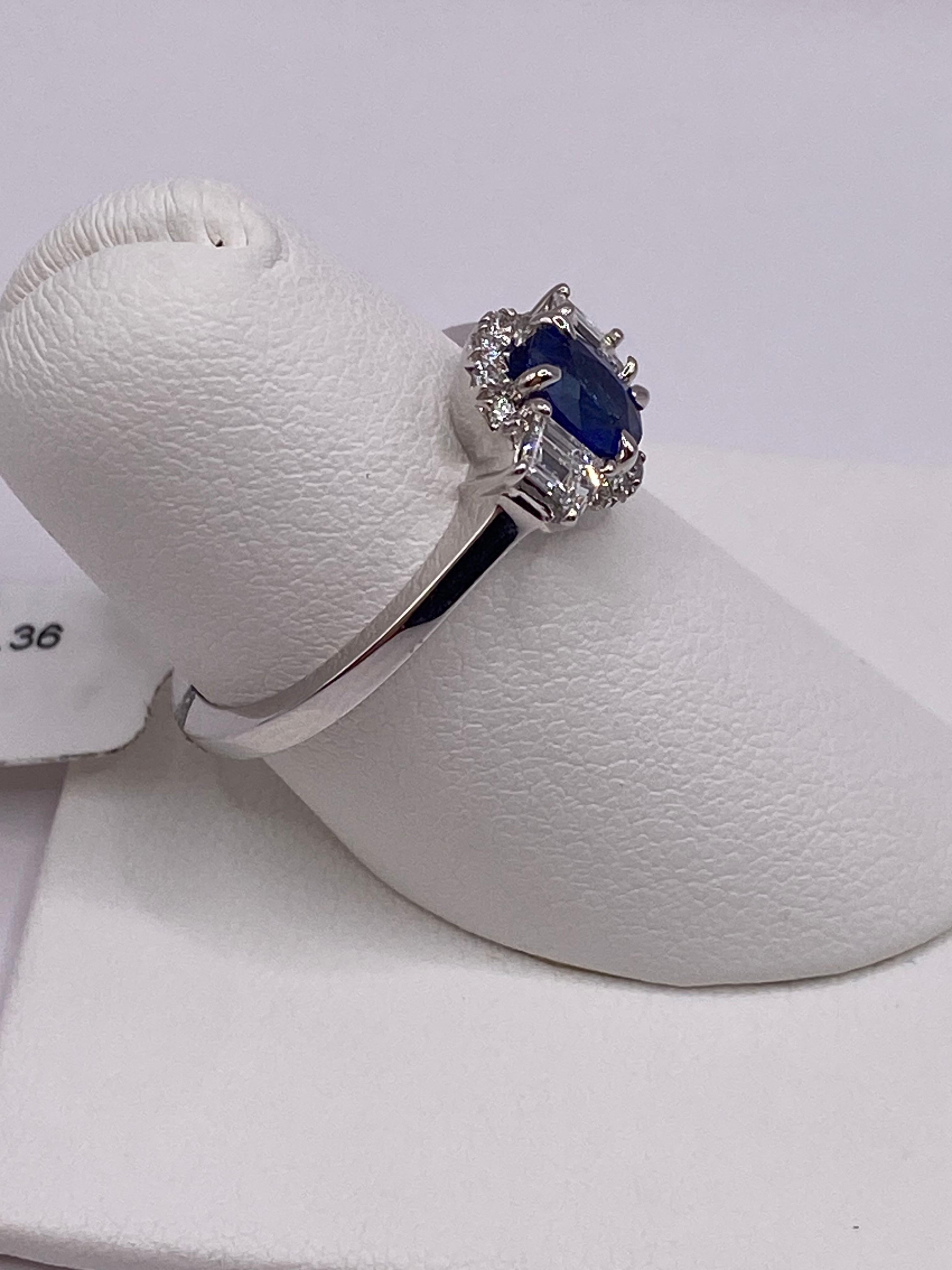 Modern 1.15ct Oval Sapphire & Trapezoid Diamond Ring in Platinum For Sale