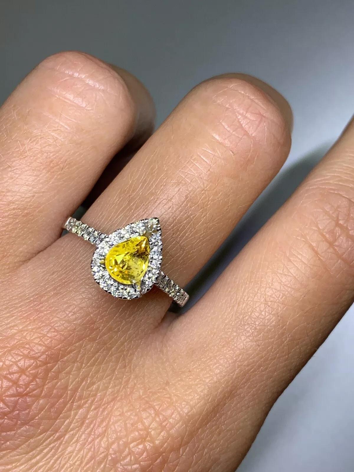 1.15ct Yellow sapphire pear diamond halo engagement ring 18ct white gold.

Gorgeous lemon yellow sapphire vivid colour total weight 0.80ct natural untreated pear shaped.

Diamond halo total weight 0.35ct diamond weight F colour VS1
