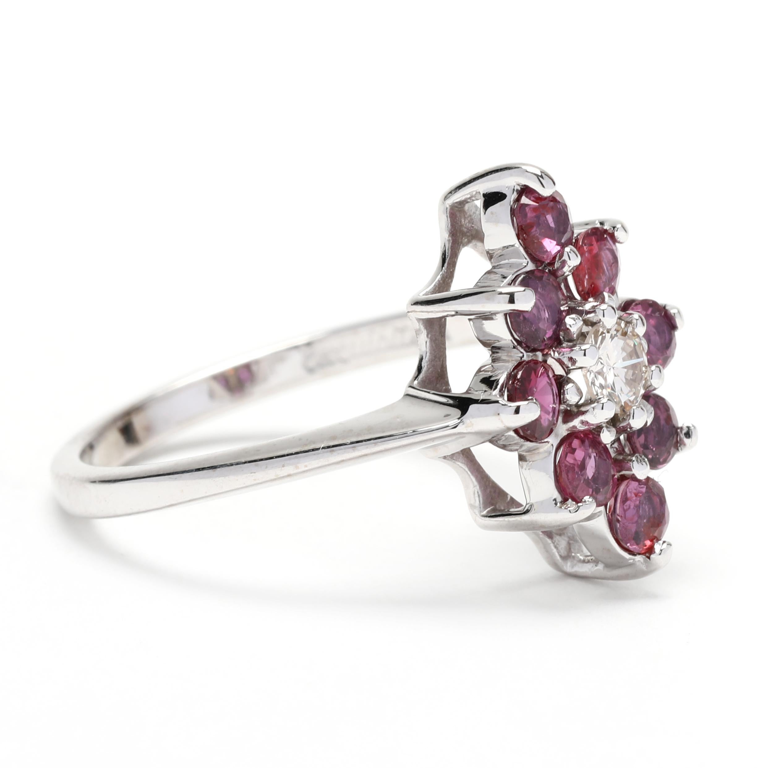 This beautiful ruby and diamond navette ring is the perfect way to add a hint of color to your jewelry collection! Crafted in 14k white gold and featuring 1.15 carats of beautiful rubies and marquise diamonds, this ring is perfect for someone born