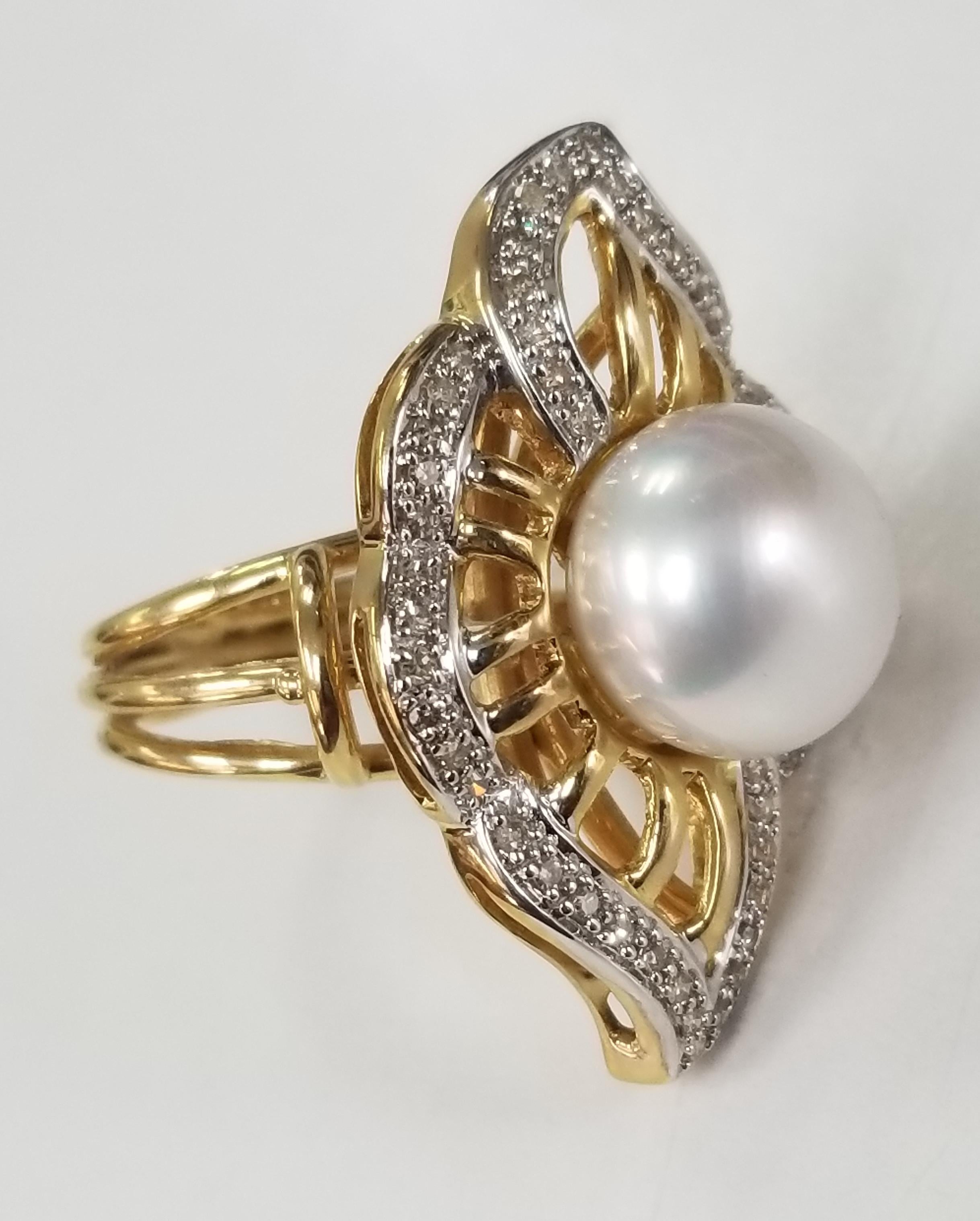 14 karat yellow gold 11.5mm South Sea Pearl and diamond ring, containing 52 single cut diamonds weighing .50pts.   This ring is a size 7 but we will size to fit for free.