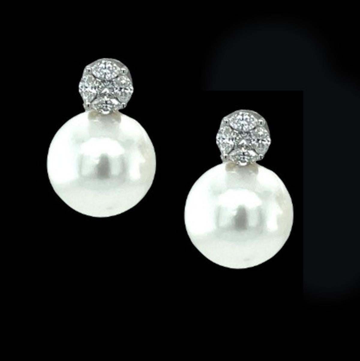 These elegant South Sea pearl and diamond earrings are a timeless classic for any high jewelry collection. The 11.50mm South Sea pearls are stunning - perfectly round and blemish-free, with gorgeous luster! We have paired these gems with diamond