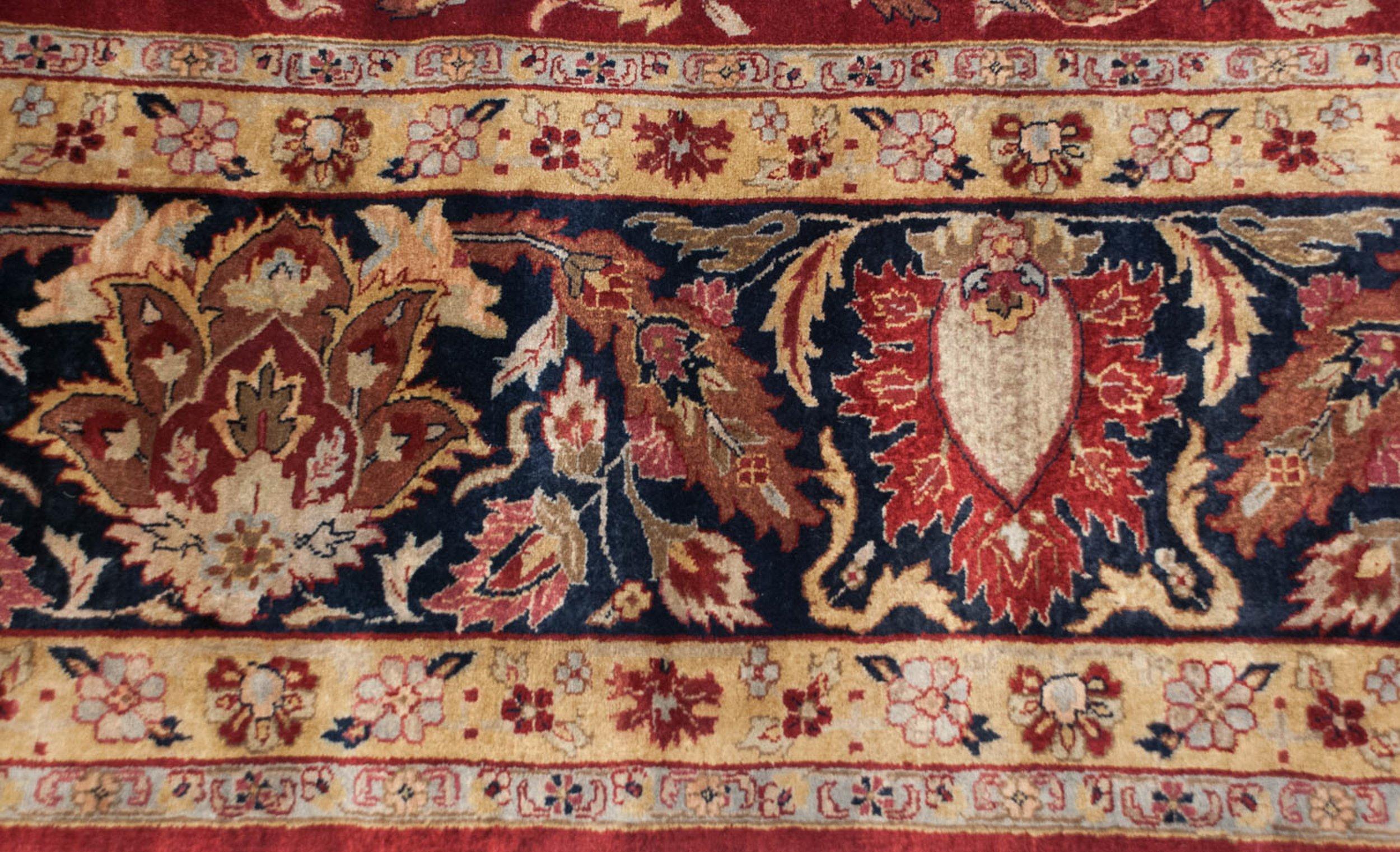 Allover covered field in a classic late 19th century design bearing scrolling tendrils, floral cross sections, bounty of detailed buds and blossoms and awesome deep saturated rich colors across. Weaver insignia top and center of the main border.