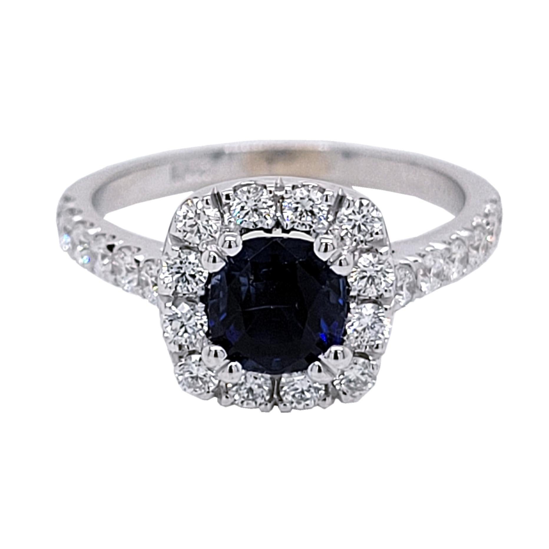 A  Beautiful Color 1.16 Ct Cushion Shaped Sapphire set in a gorgeous 18k gold  Pave set engagement Ring with halo. Total diamond weight of 0.61 Ct. diamonds on the side. 

Center stone: 1.16 Ct Cushion Shape Sapphire
Side stones: 0.61 total carat