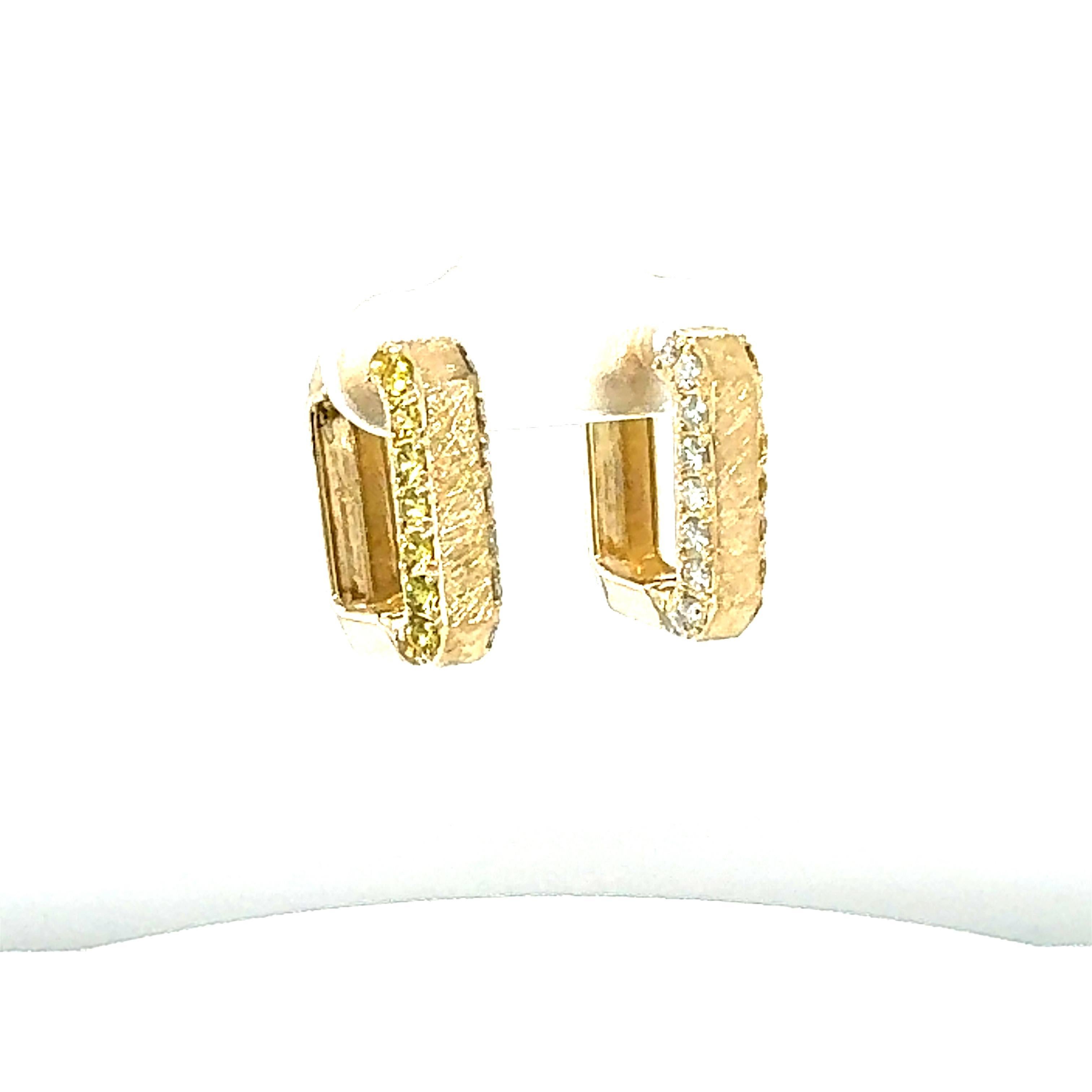 Beautiful and classy Yellow Gold Diamond and Yellow Sapphire Hoop Earrings

Item Specifics:

18 Natural Round Cut White Diamonds weighing approximately 0.46 carats
Clarity: SI1, Color: F
18 Natural Round Cut Yellow Sapphires weighing approximately