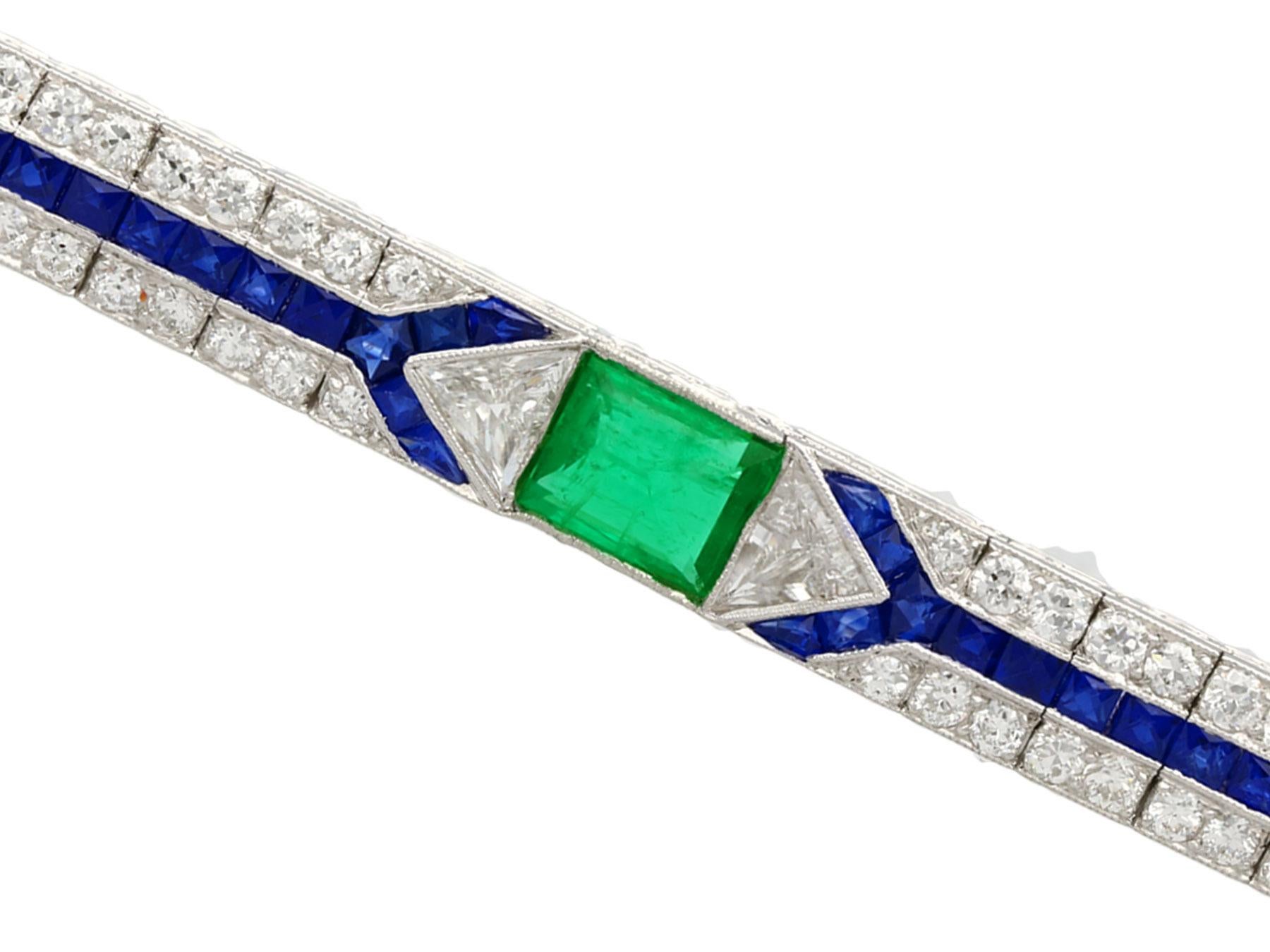 Emerald Cut 1.16 Carat Emerald 1.90 Carat Sapphire and 3.06 Carat Diamond Platinum Brooch
