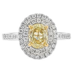 Anillo de compromiso con doble halo de diamantes ovalados amarillos de fantasía de 1,16 quilates