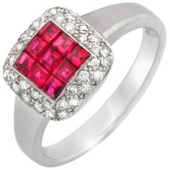 Bague en or 18 carats sertie d'un rubis de 1,16 carat et de diamants de 0,32 carat, sertis de façon invisible