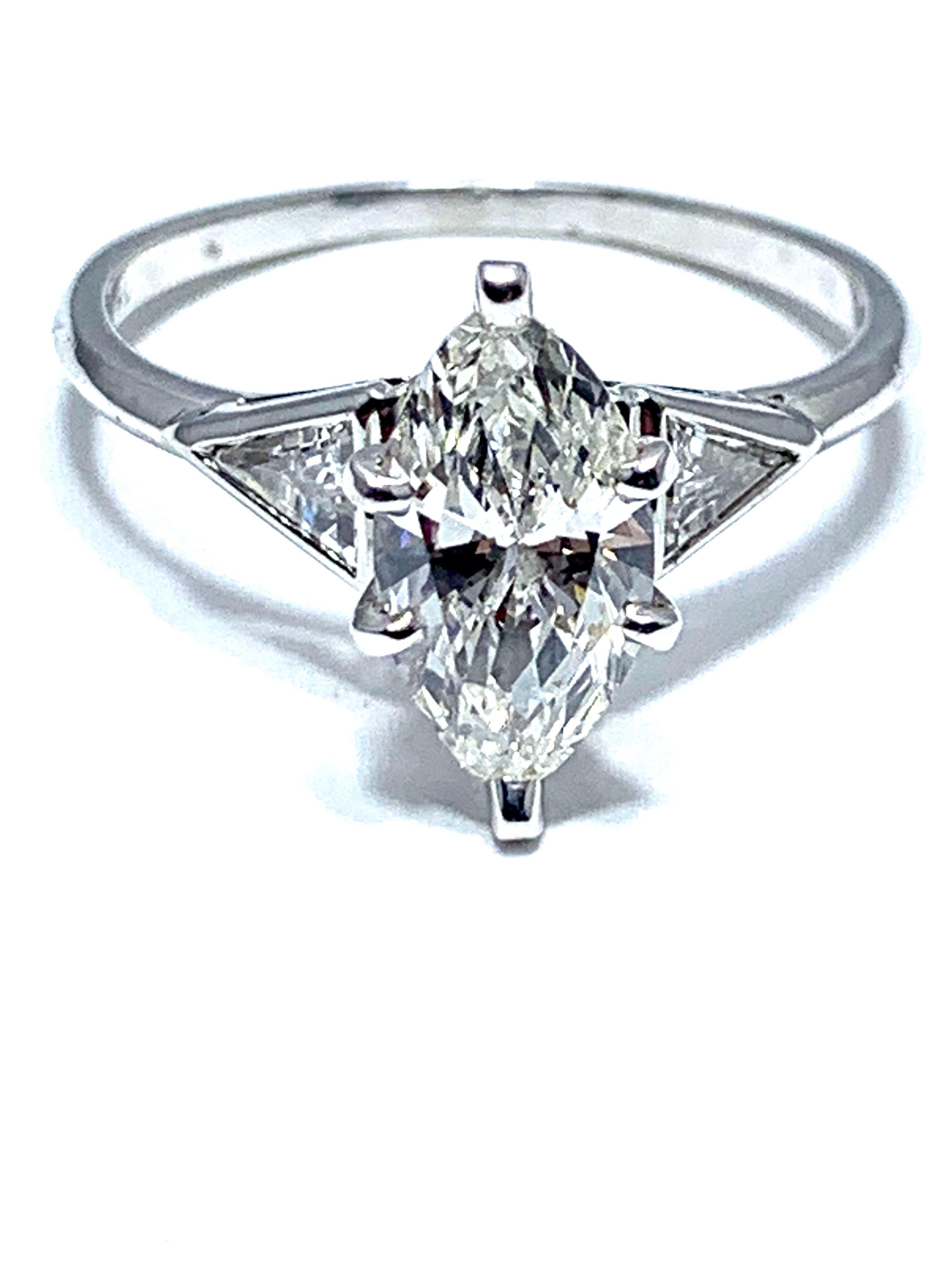 A beautiful 1.16 carat marquise and trilliant cut diamond engagement ring.  The center marquise is set in a six prong platinum head, with two trilliant cut diamonds on each side, and a platinum shank.  The marquise is graded by GIA as F color, VS2