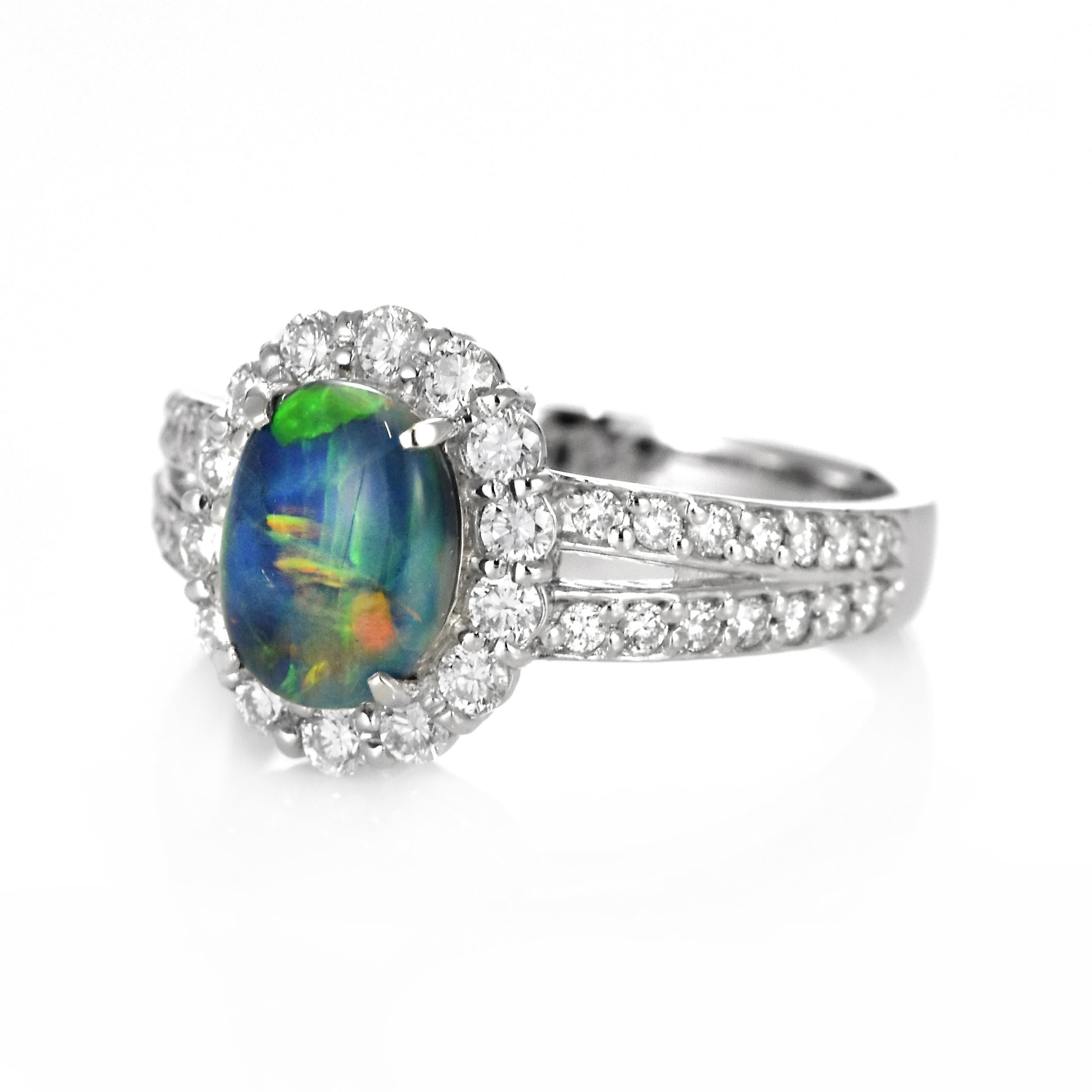Modern 1.16 Carat Natural Australian Black Opal and Diamond Ring Made in Platinum For Sale