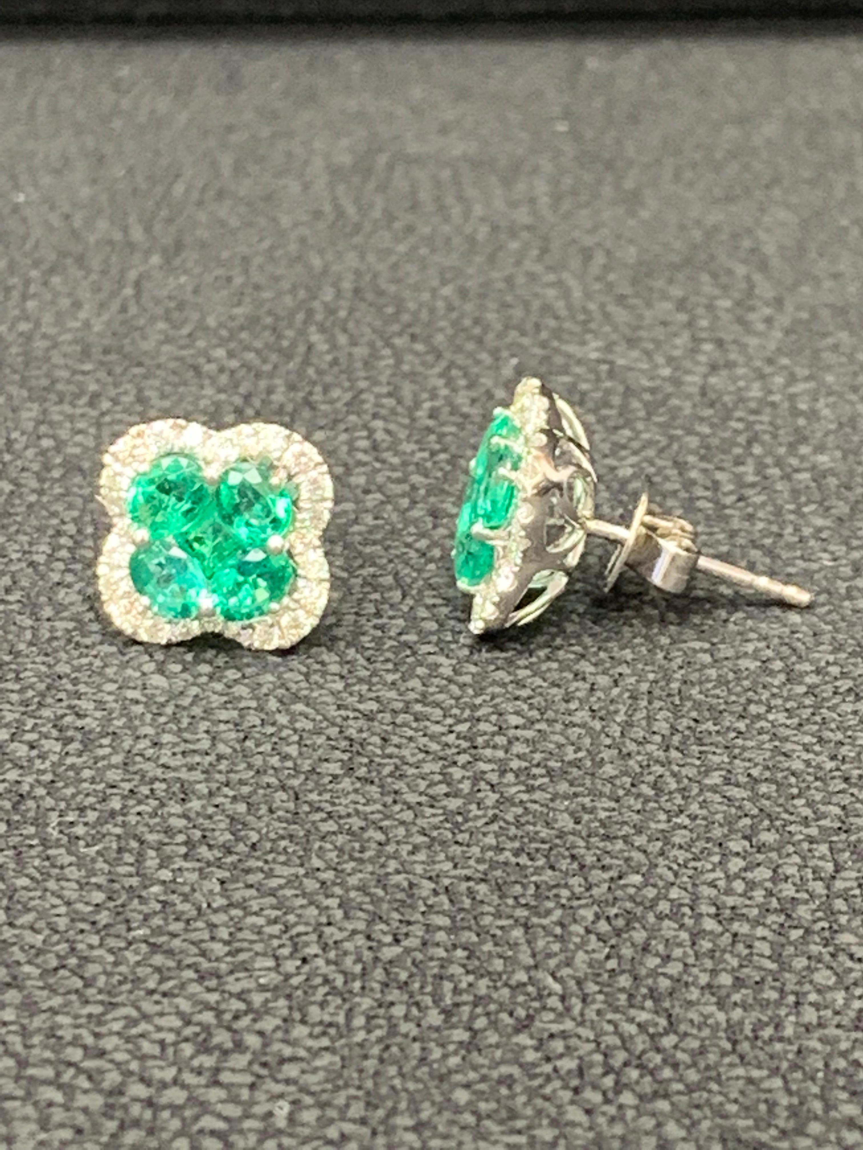 Women's 1.16 Carat Oval cut Emerald and Diamond Stud Earrings in 18K White Gold For Sale
