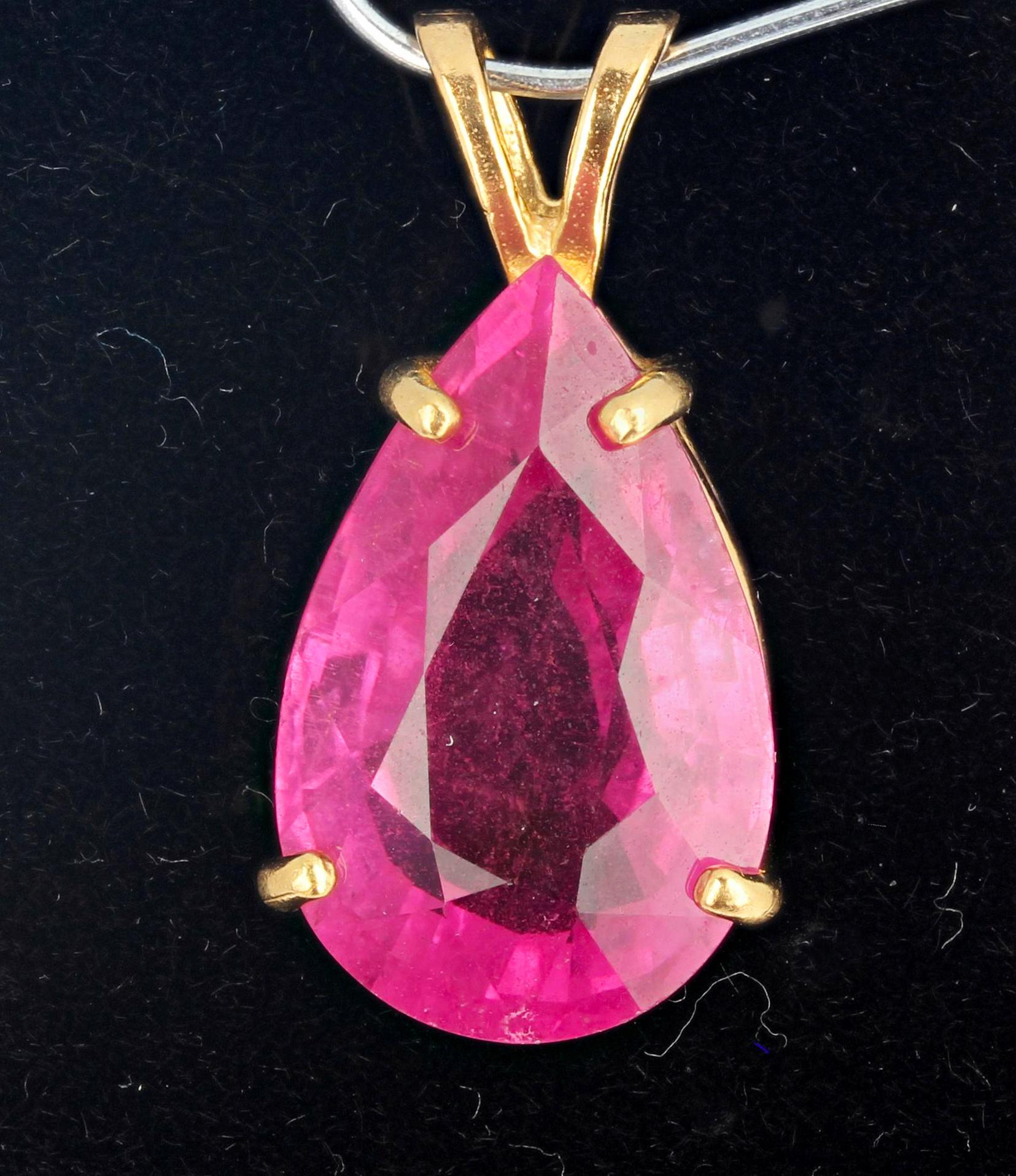 Brilliantly sparkling 11.6 Carat natural unique translucent Brazilian pink Tourmaline set in 14KT yellow gold pendant.  Natural inclusions only visible with magnifier this is so clean.  The gemstone measures 18.6 mmx 11.5 mm and glitters