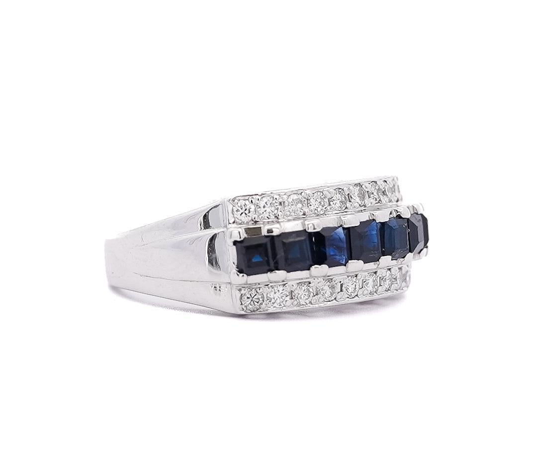1.16 Carat Sapphire and Round Cut Diamond Cluster Band Ring in Platinum. The ring is layered with one band of sparkling and elegant dark blue sapphire surrounded by two bands of round cut 0.32 Carat clean and shining diamonds giving it a lot of