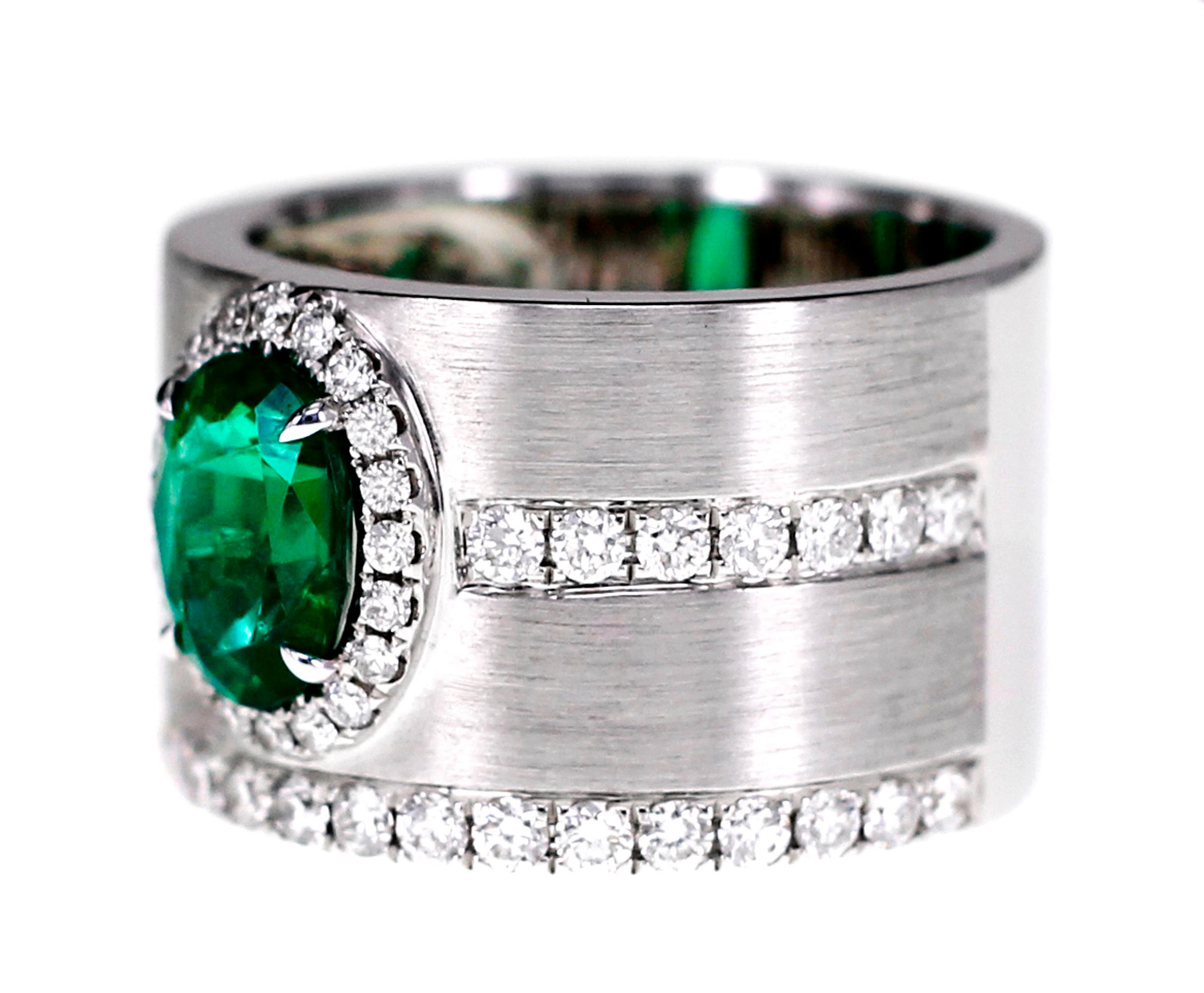 1.16 carat vivid green soothing emerald set in a Matt finish ring which can be feature in a hand made ring. Also the emerald is accompanied by 0.82 carats of white round brilliant cut diamond. The details of the diamond are as follows:
Color: