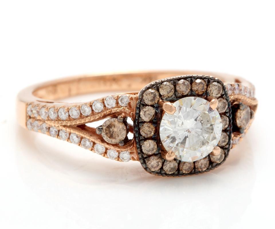 1.16 Carats Splendid Natural Diamond 14K Solid Rose Gold Band Ring

Stamped: 14K

Total Natural Round Cut White and Champagne Diamonds Weight: Approx. 0.53 Carats (color G-H & Champagne / Clarity SI1-SI2)

Center Diamond is 0.63Ct (SI2 / G)

The