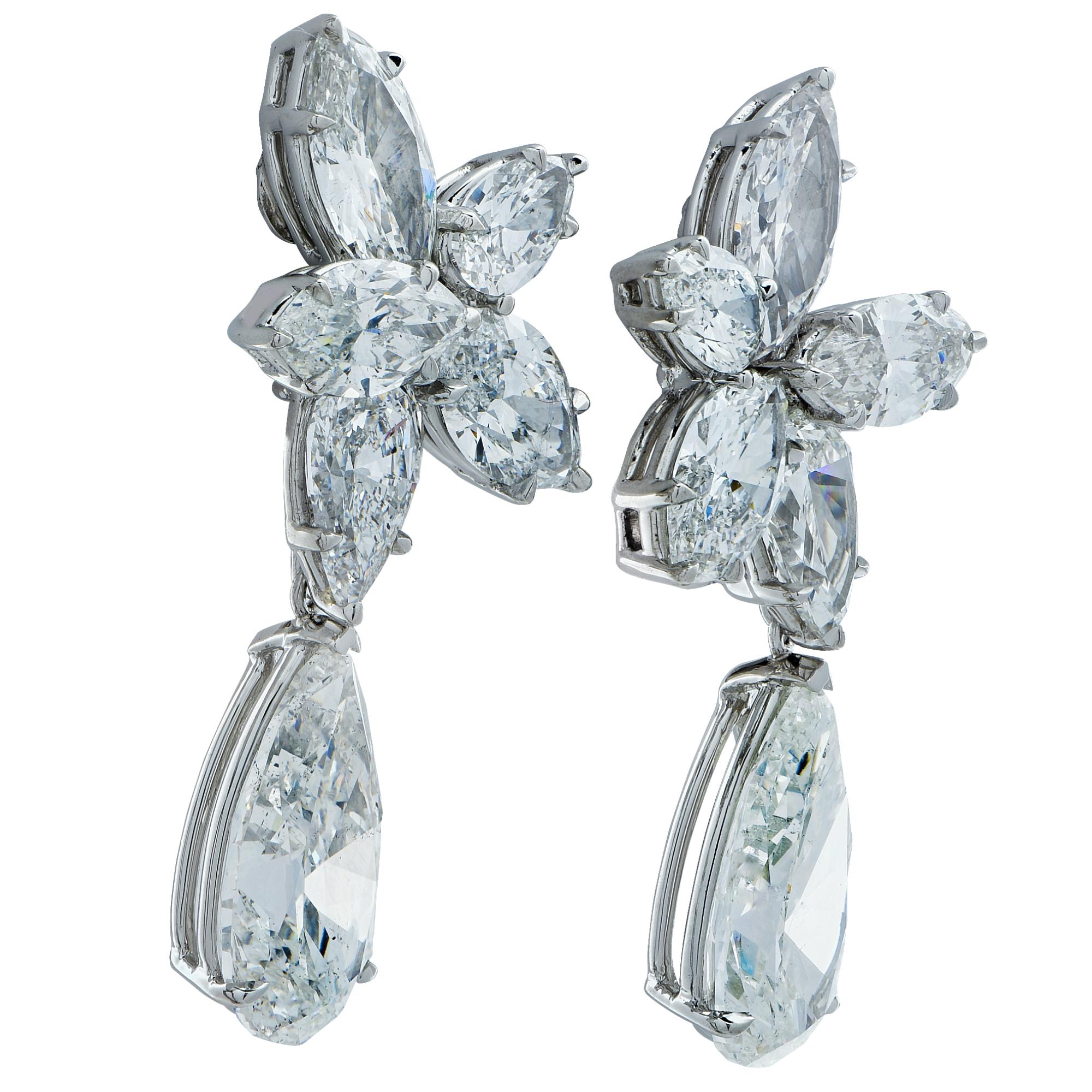Sensational diamond day and night earrings, handmade in platinum. These magnificent dangle earrings showcase 2 matching certified pear shape diamonds weighing 5.81 carats total, G Color and SI clarity, suspended from a dazzling cluster of 10 mixed