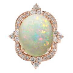 Bague en or rose 14 carats avec opale et diamant