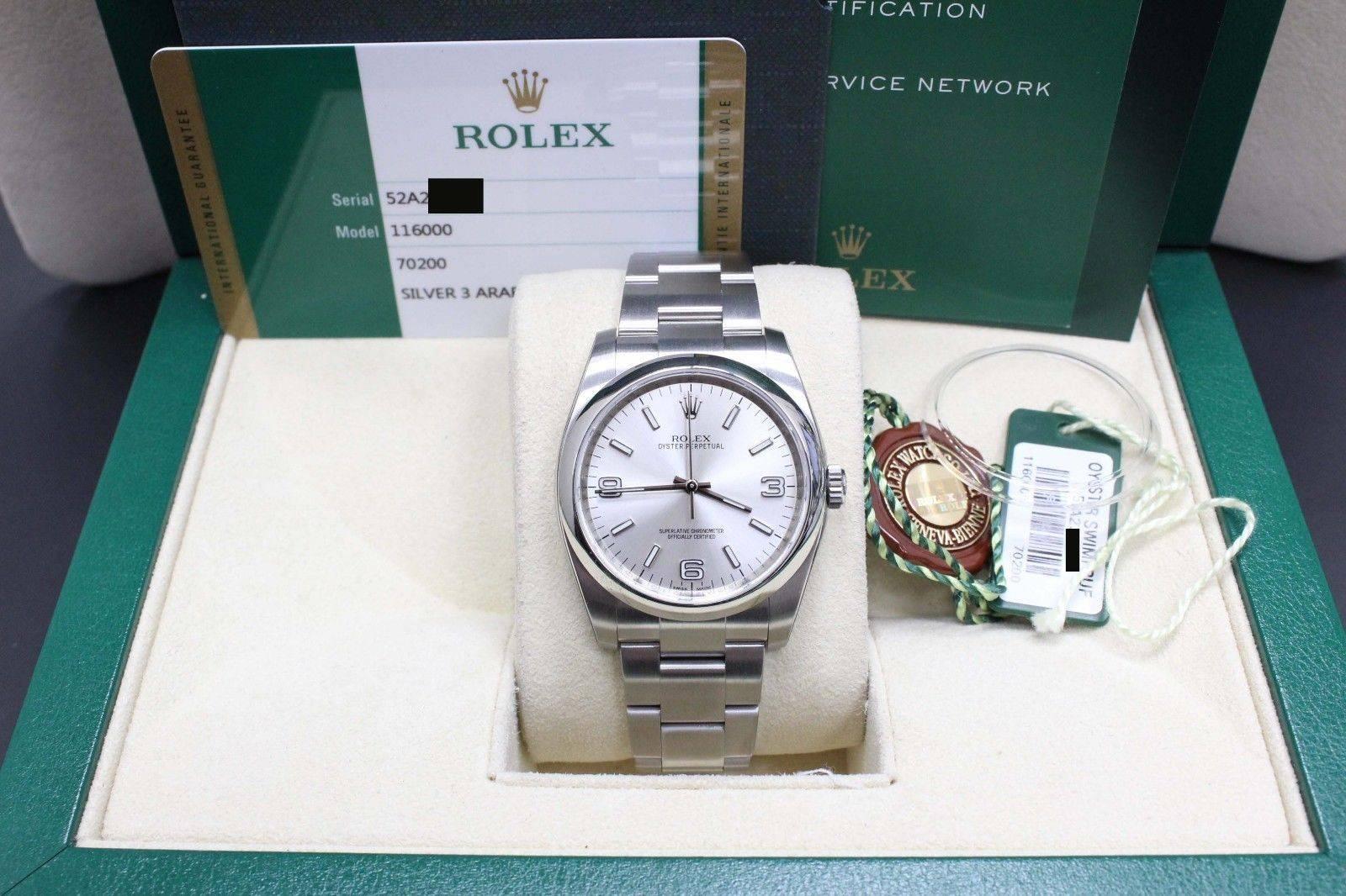 Style Number: 116000
Serial: 52A23***
Year: 2015
Model: Oyster Perpetual 
Case Material: Stainless Steel
Band: Stainless Steel
Bezel: Stainless Steel
Dial: Silver
Face: Sapphire Crystal
Case Size: 36mm
Includes: 
-Rolex Box & Papers
-Certified
