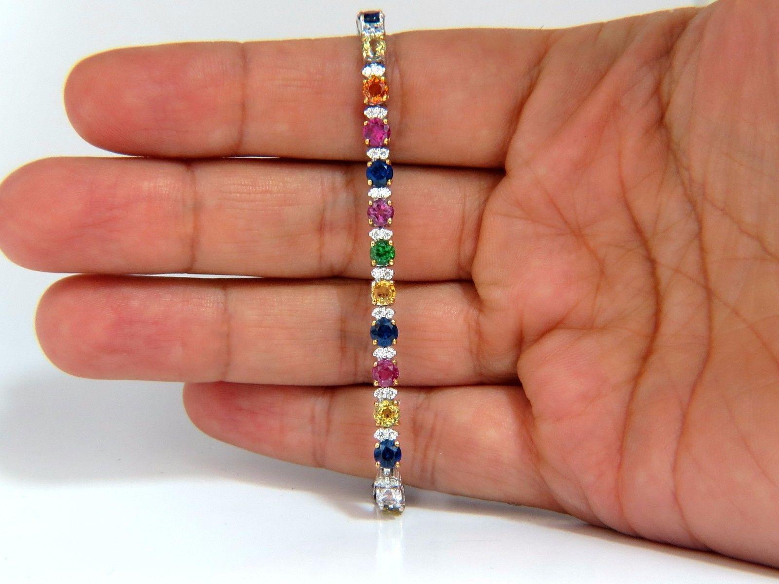 Colors Explained.

10.52ct. Natural Sapphires, Tsavorite, Emeralds

 & 1.10ct Diamonds bracelet.

Full round cuts, great sparkle.

Vibrant Greens, Orange, Reds, yellows, Blues and Pinks/

Clean Clarity & Transparent.

Diamonds: G-color Vs-2