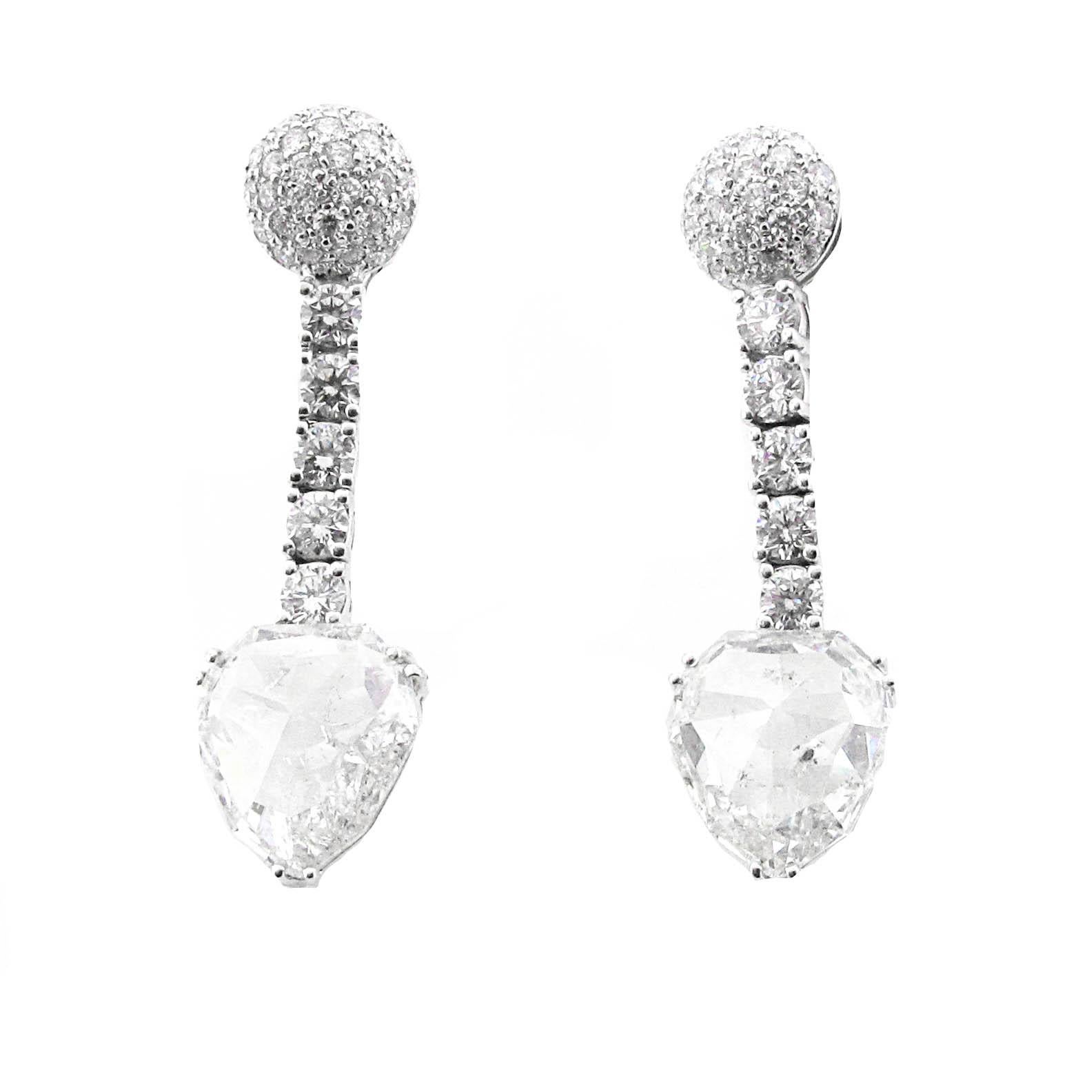 18 karat white gold rose cut diamond dangle earrings. These earrings have a total diamond weight of 11.65 carats. The tops of both earrings are made with round brilliant diamonds. One of the earrings, not including the bottom stone, weighs 1.21