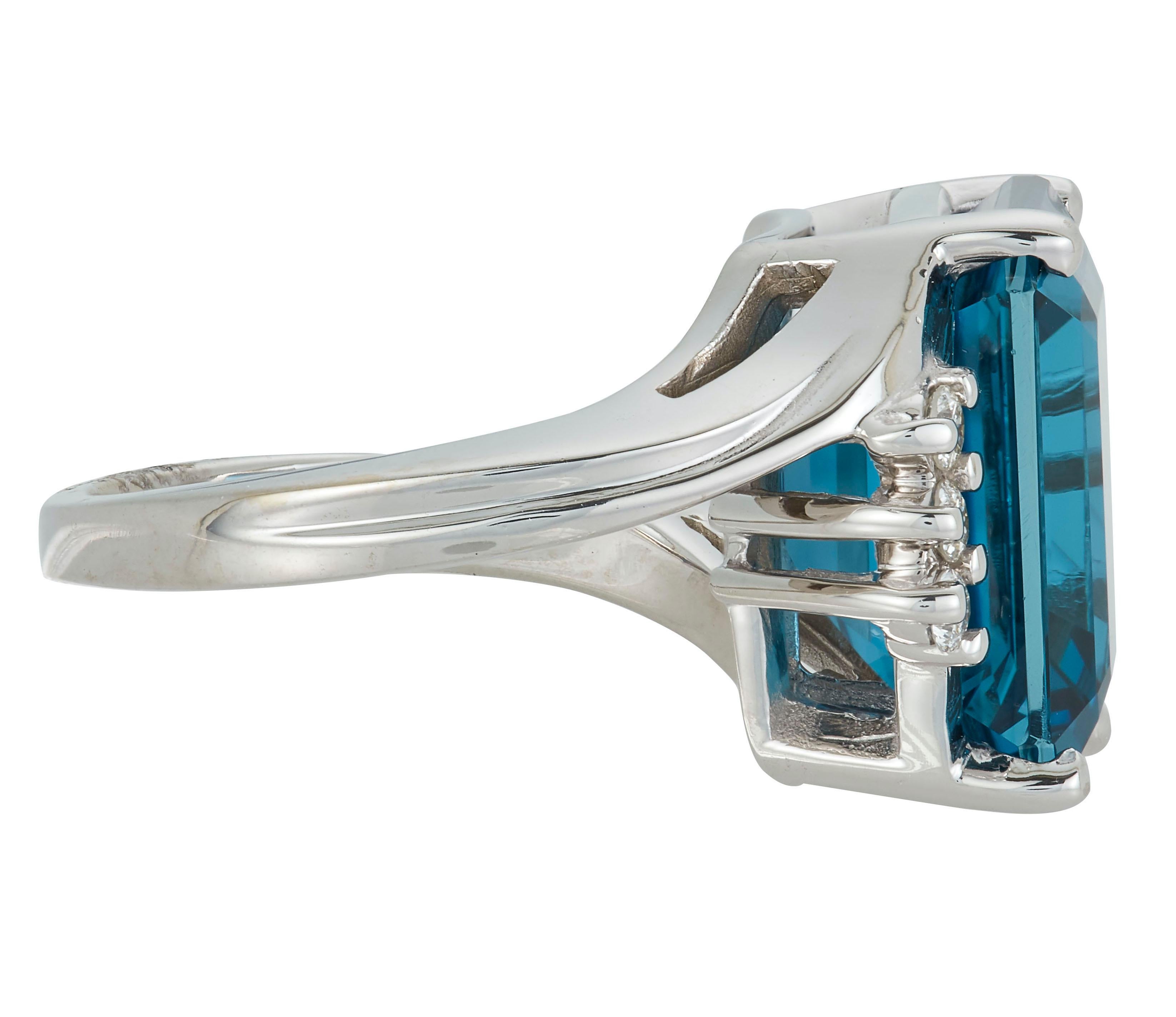 14K White Gold
1 Emerald Cut Blue Topaz at 11.66 Carats - Measuring 12 x 14 mm
6 Brilliant Round White Diamonds at 0.18 Carats - Color: H-I /Clarity: SI

Alberto offers complimentary sizing on all rings.

Fine one-of-a-kind craftsmanship meets