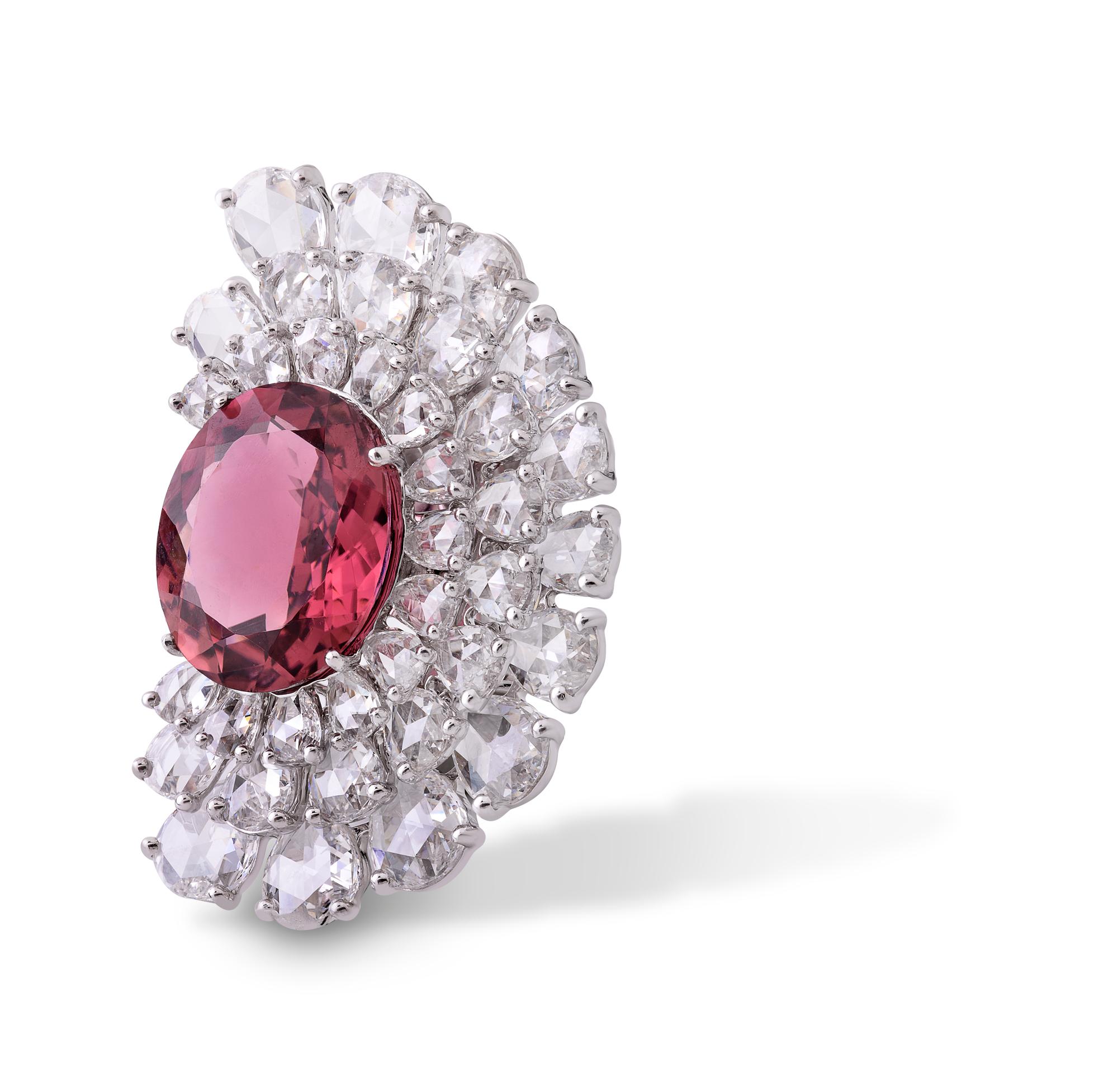 These bold, fan-shaped earrings, set with 5.78cts of fancy shape rose cut diamonds surrounding a pair of striking hand-cut rubellite stones, evoke an aura of mystery. 

- Butterfly fastening for pierced ears
- This piece is handmade and as such may