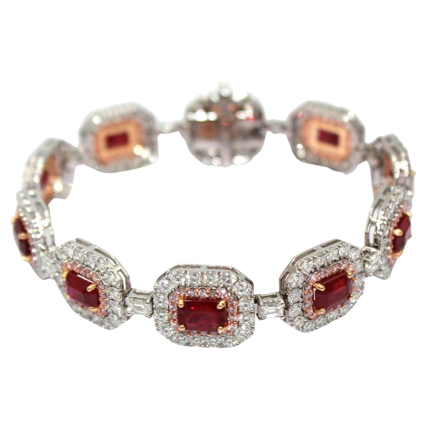 11.69 carats emerald-cut Burma Ruby with totaling a diamond weight of 10.48 carats. 

This stunning Ruby & Diamond Bracelet will highlight your uniqueness and elegance. 

Item Details:
- Type: Bracelet
- Metal: 18K Gold 

Color Stone Details:
-