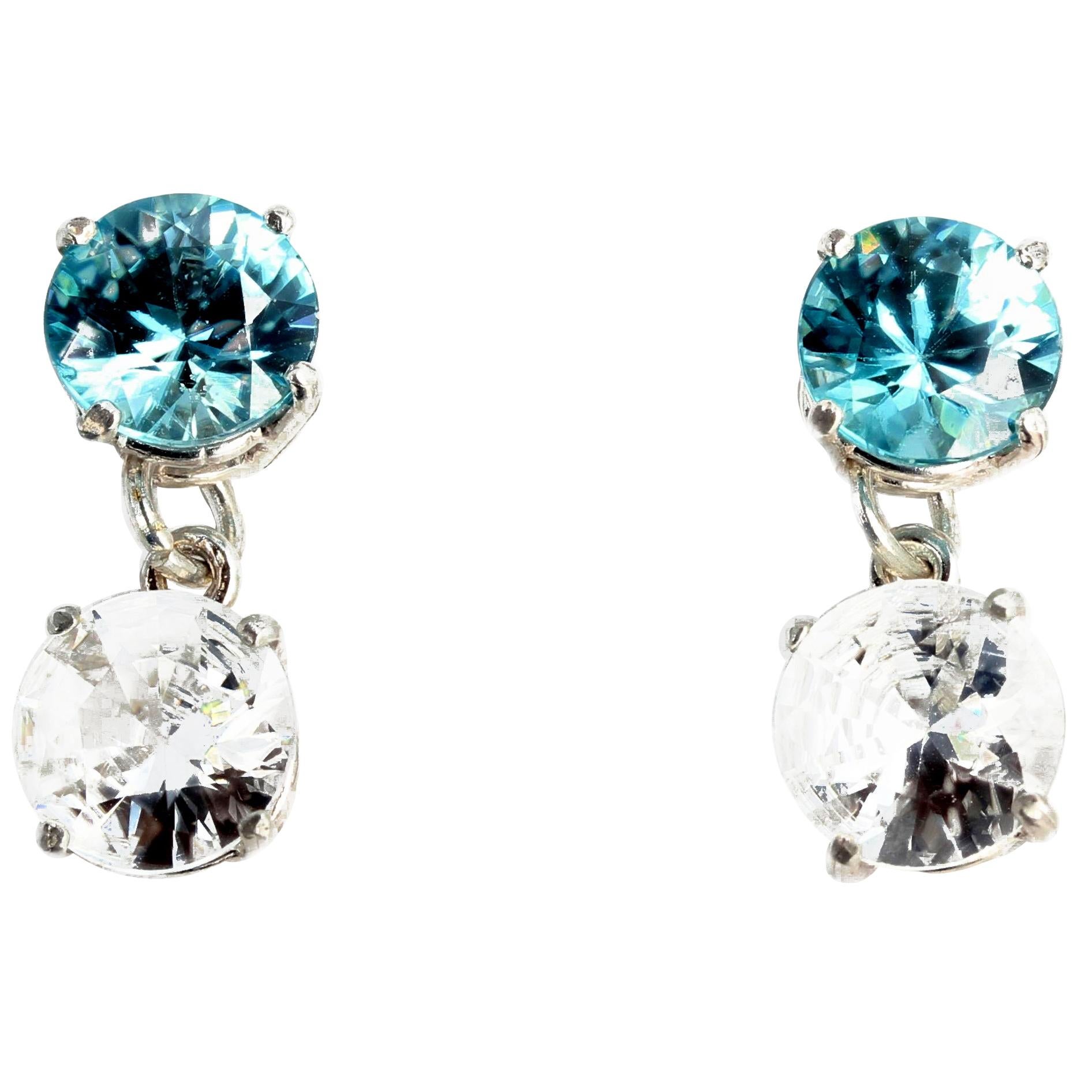 5.69 carats total of brilliant blue round (8.8 mm) unique Zircons dangle 6 carats total of elegant glittering white Zircons (8.9 mm) set in handmade sterling silver stud earrings.  They hang .8 inches long. If you wish faster delivery on your